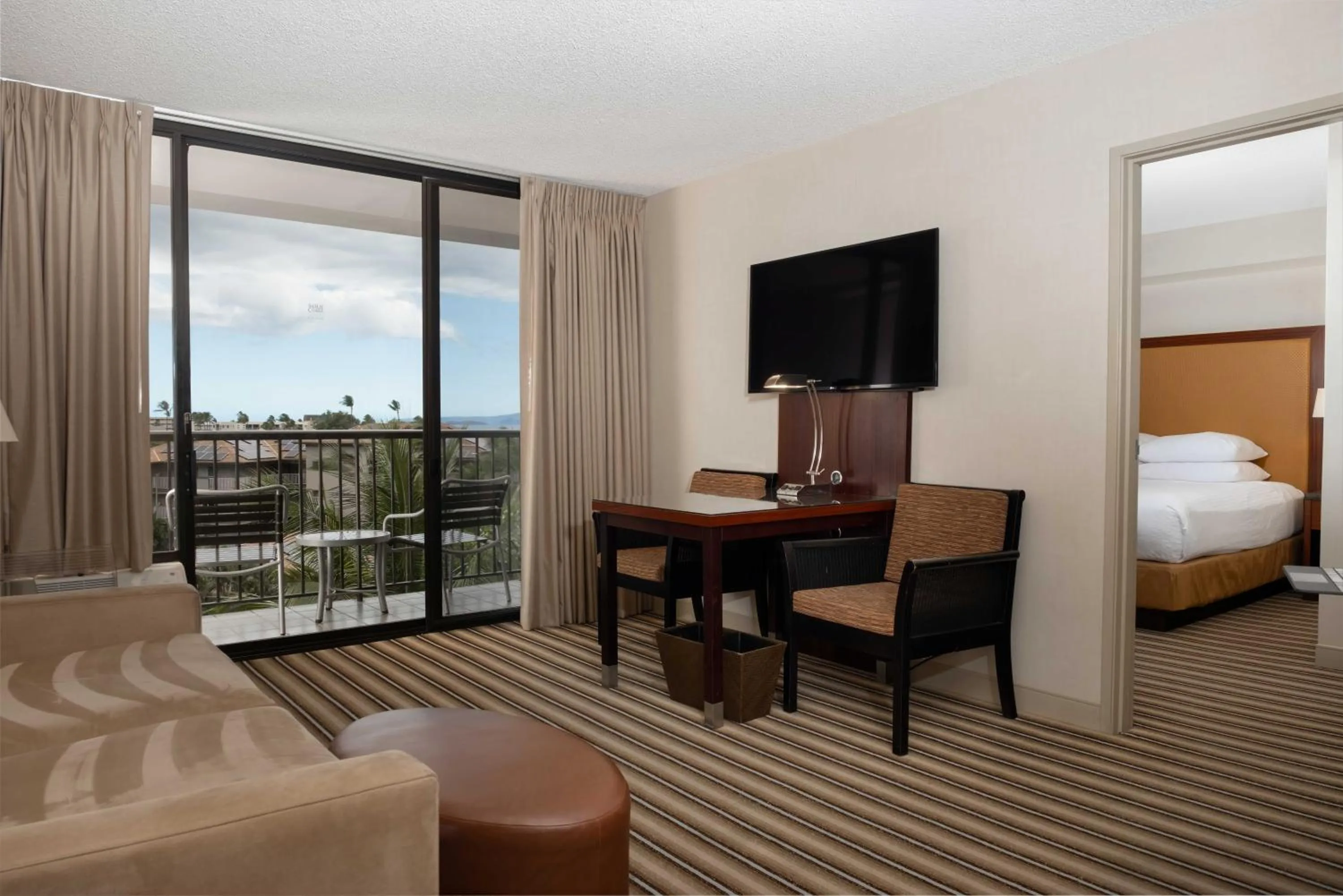 Living room, Bed in Maui Coast Hotel
