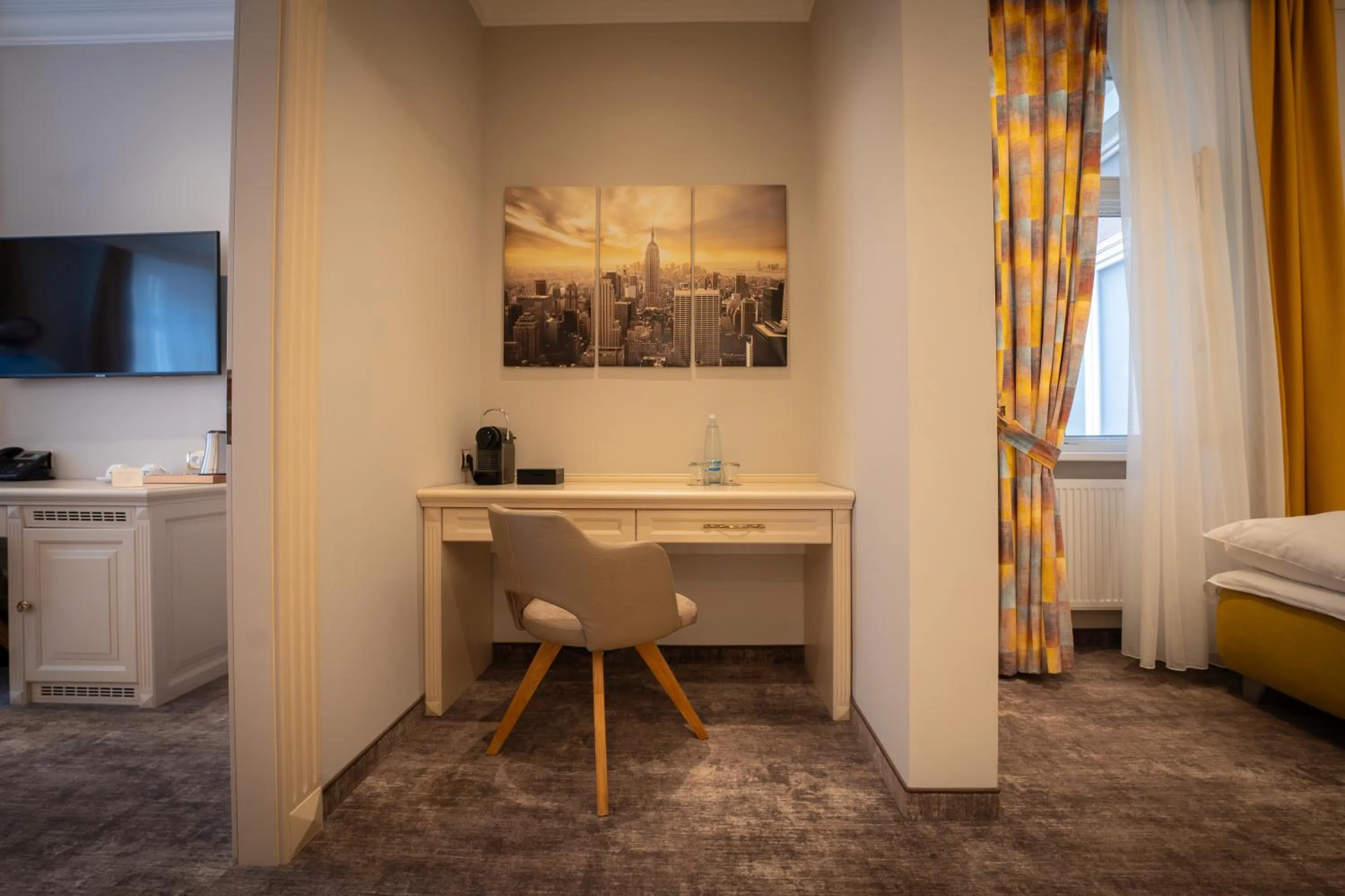 Seating area, Bed in Golden Key Boutique Hotel