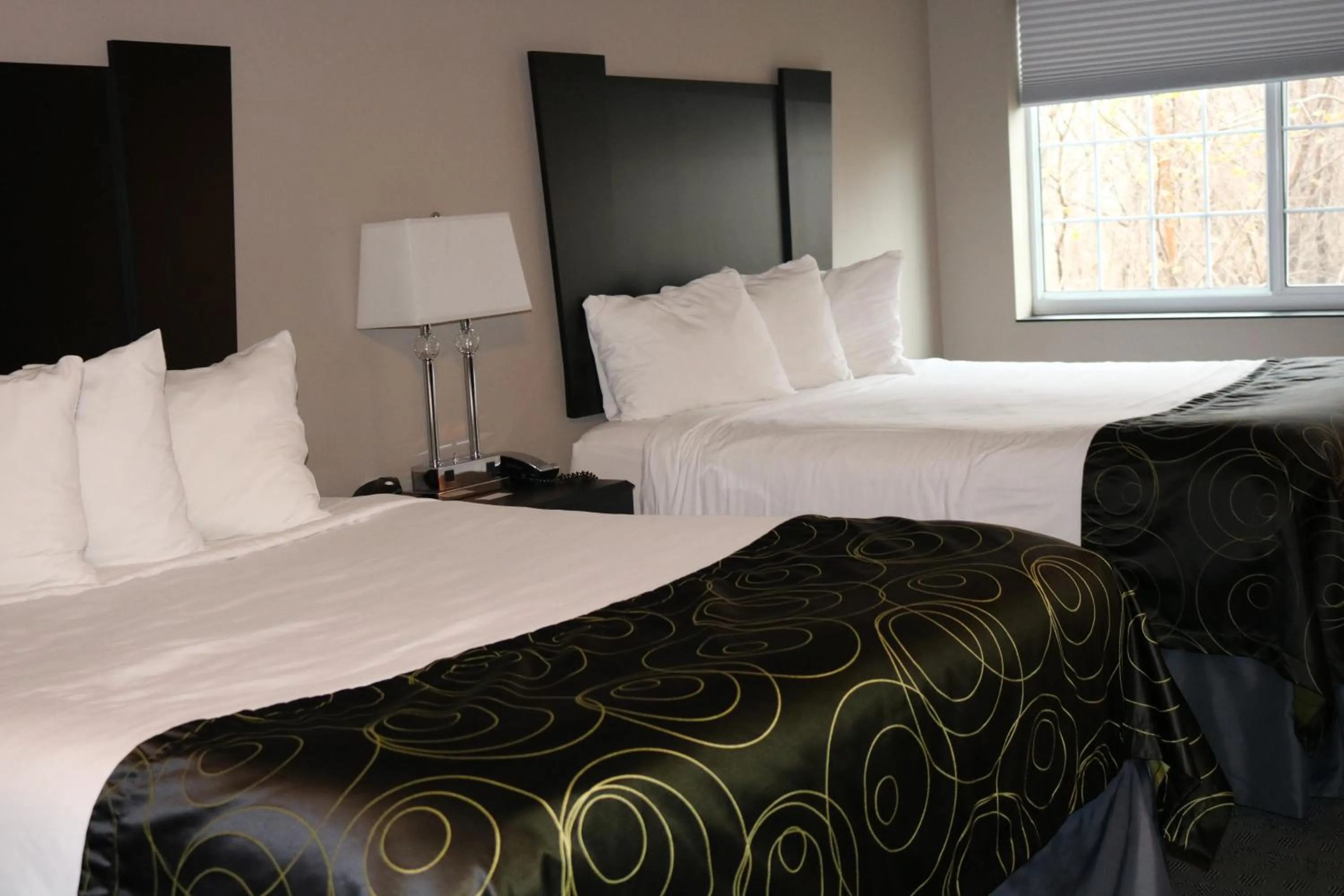 Bed in Okoboji Inn & Suites