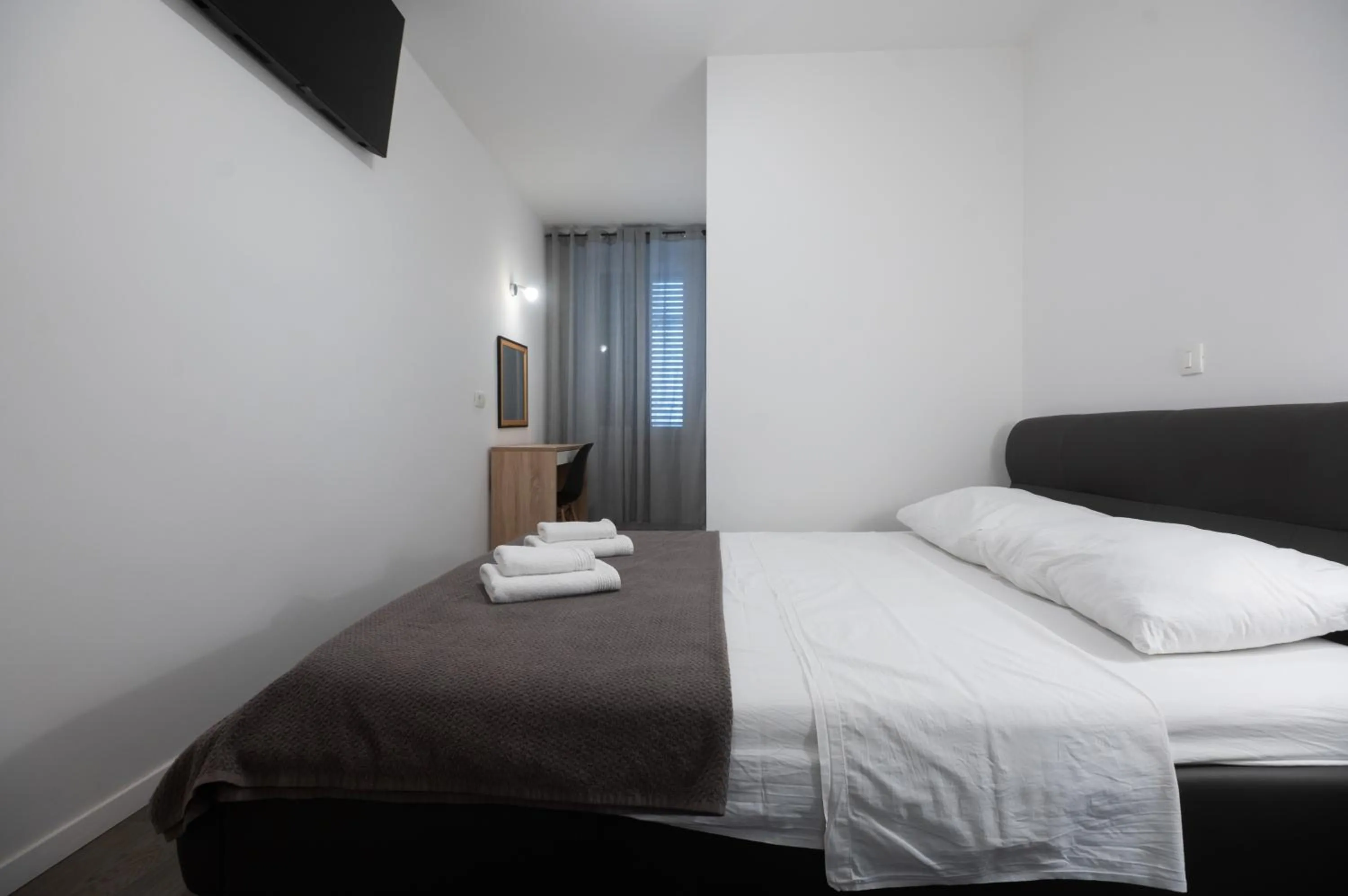 Bed in Pyrotima Apartments