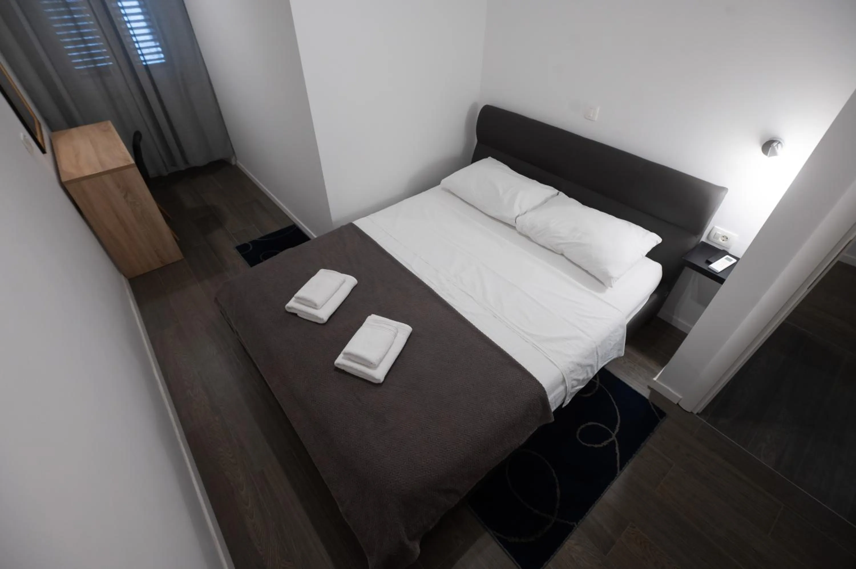 Bed in Pyrotima Apartments