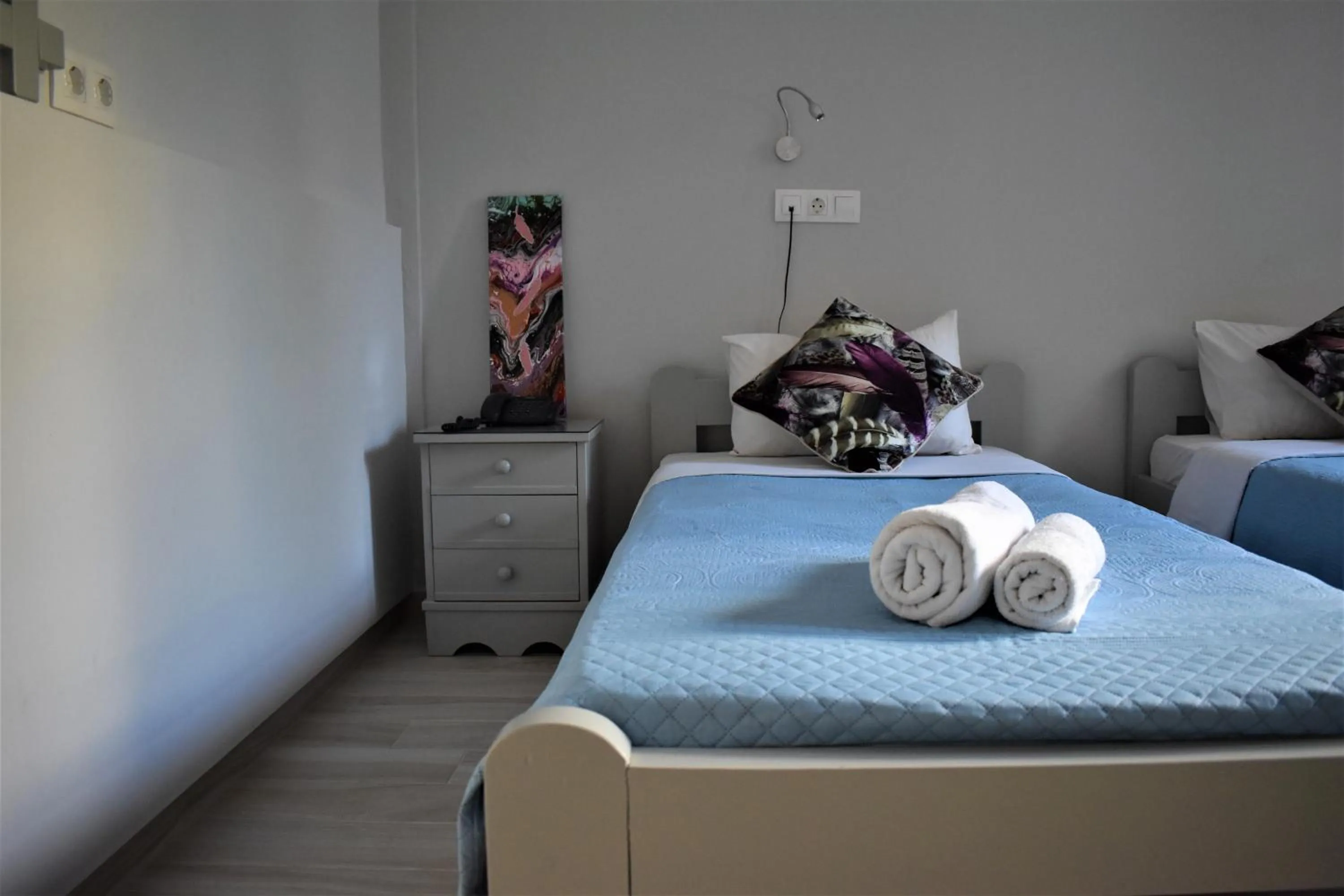 Bed in Aphrodite Art Hotel Aegina