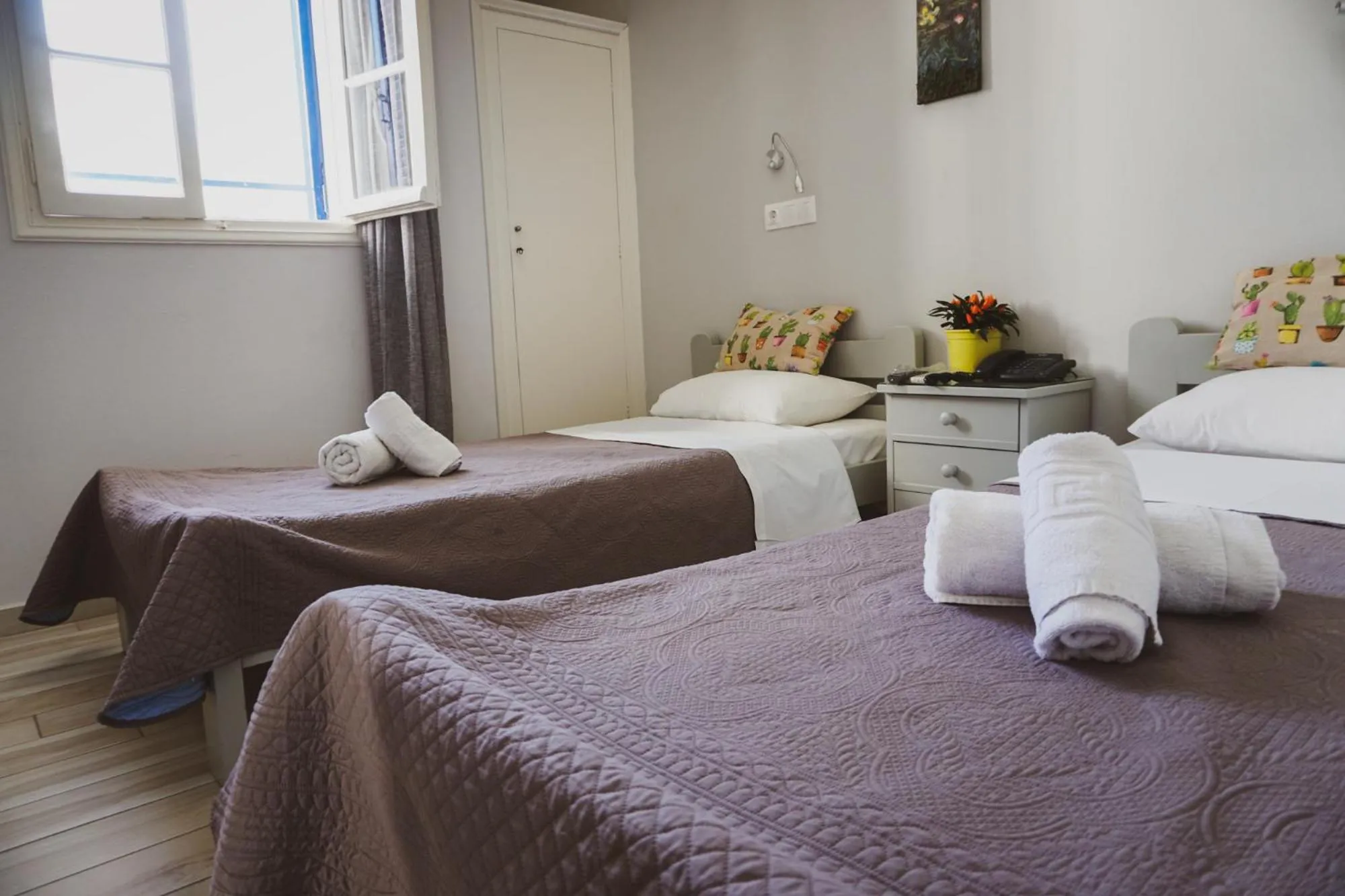 Bed in Aphrodite Art Hotel Aegina