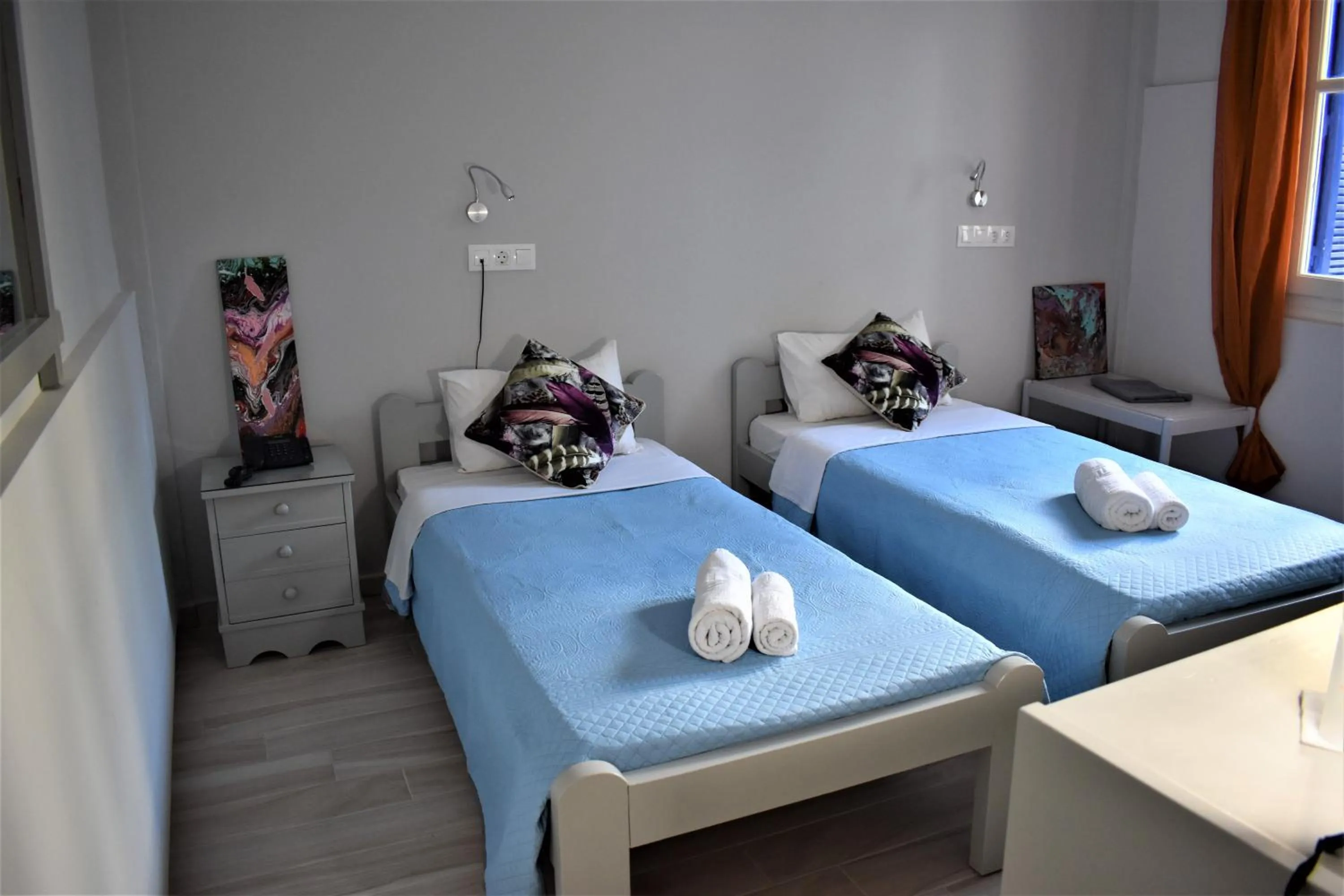 Bed in Aphrodite Art Hotel Aegina