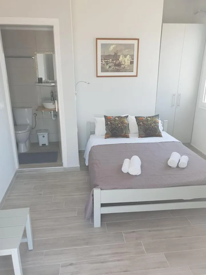 Bed in Aphrodite Art Hotel Aegina