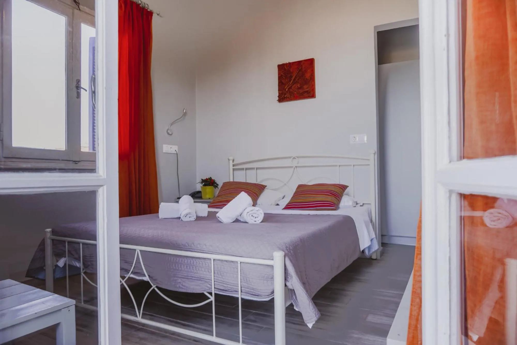 Bed in Aphrodite Art Hotel Aegina