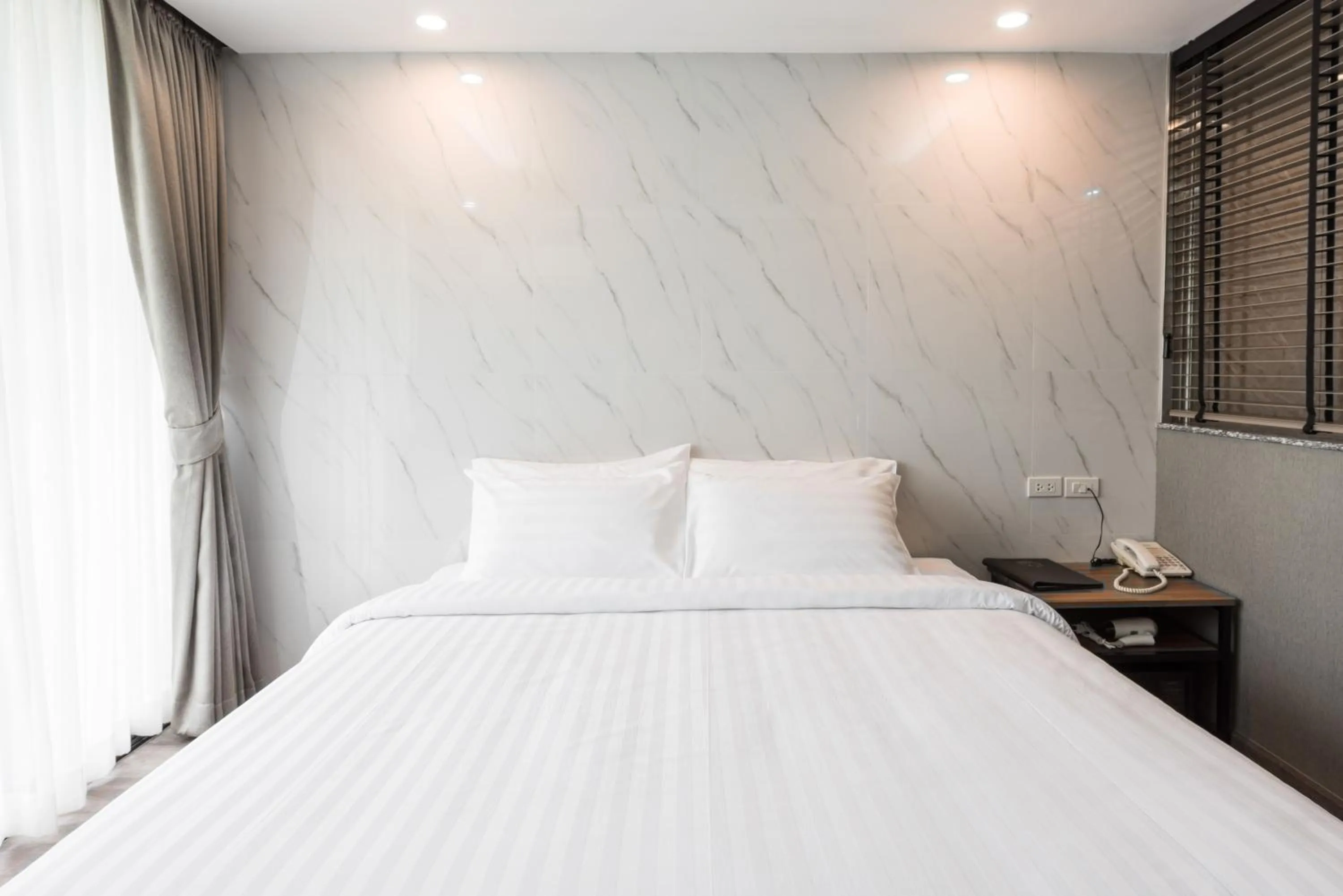 Bed in Bangkok City Link Hotel