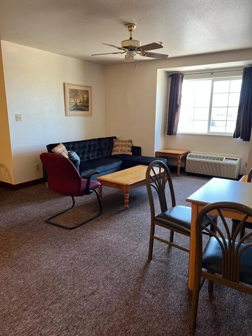 Living room in Boarders Inn & Suites by Cobblestone Hotels - Brush