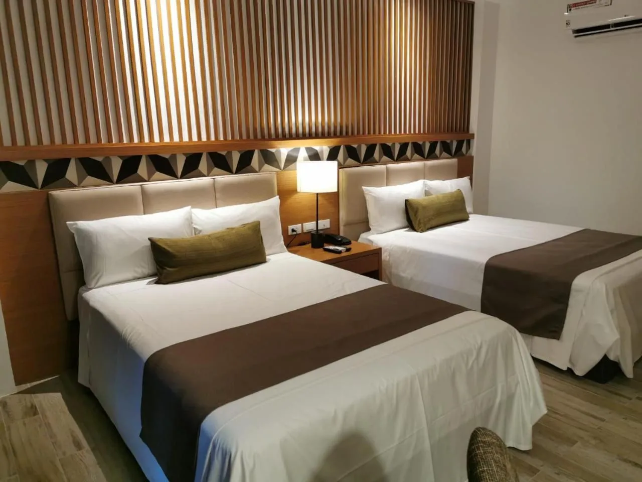 Photo of the whole room, Bed in Crown Hotel at Harbour Springs Palawan Managed by Enderun Hotels