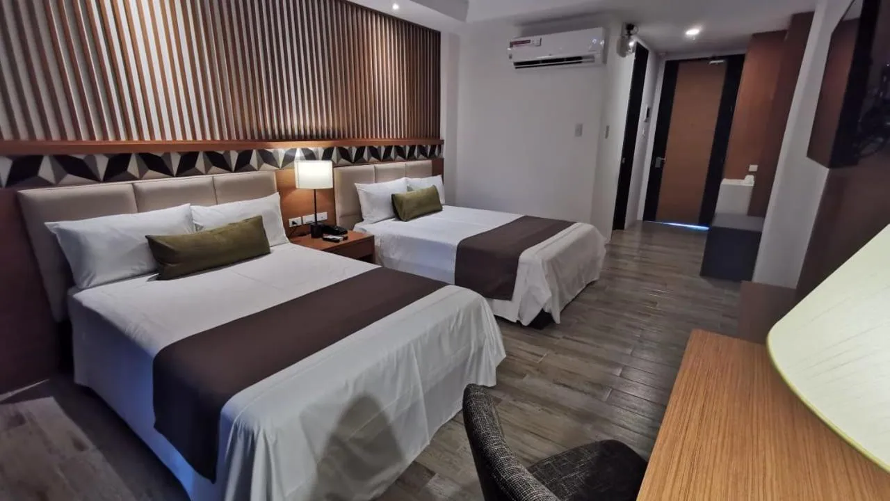 Photo of the whole room, Bed in Crown Hotel at Harbour Springs Palawan Managed by Enderun Hotels