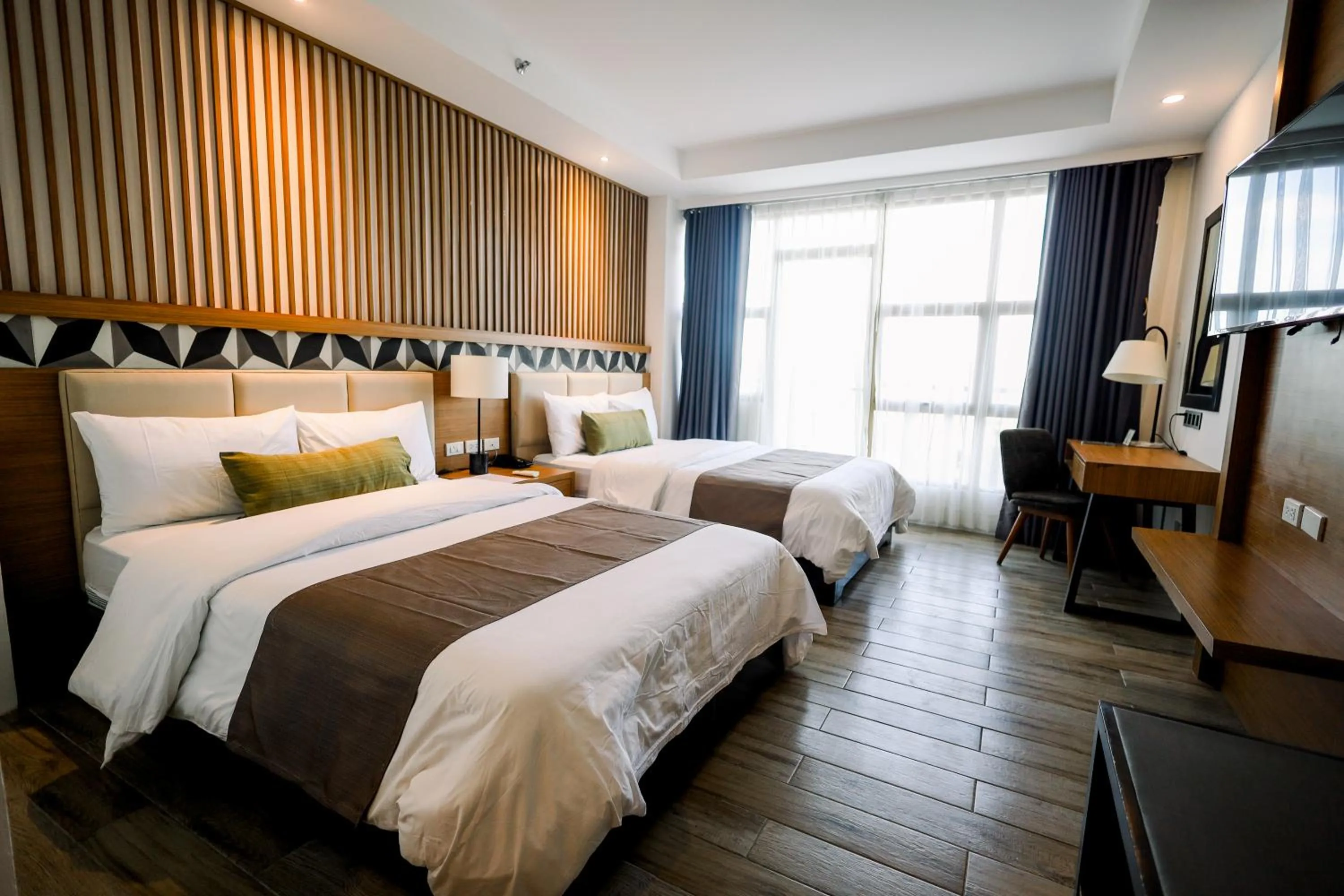 Photo of the whole room, Bed in Crown Hotel at Harbour Springs Palawan Managed by Enderun Hotels