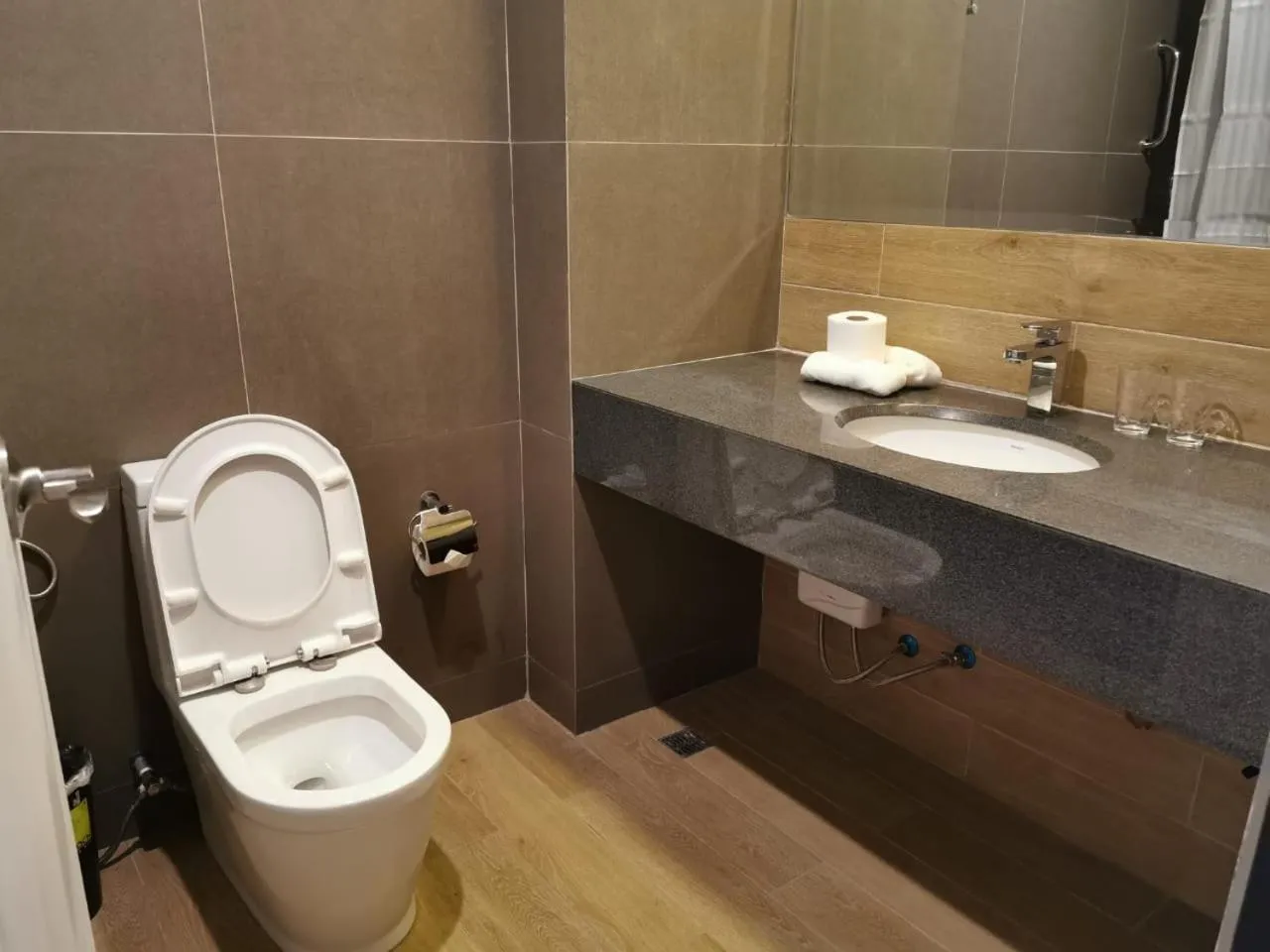 Toilet in Crown Hotel at Harbour Springs Palawan Managed by Enderun Hotels