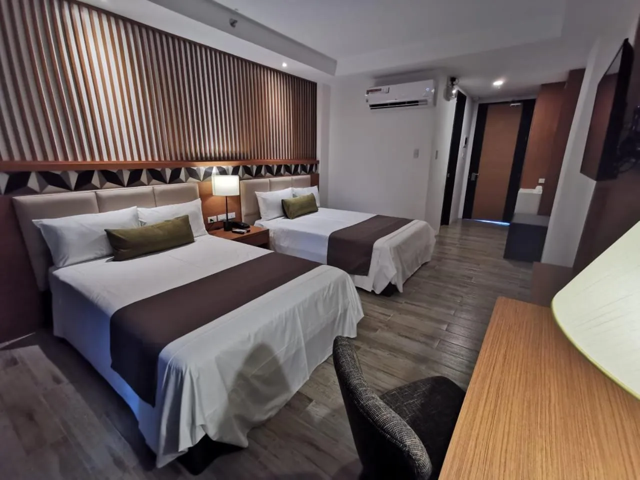 Photo of the whole room, Bed in Crown Hotel at Harbour Springs Palawan Managed by Enderun Hotels