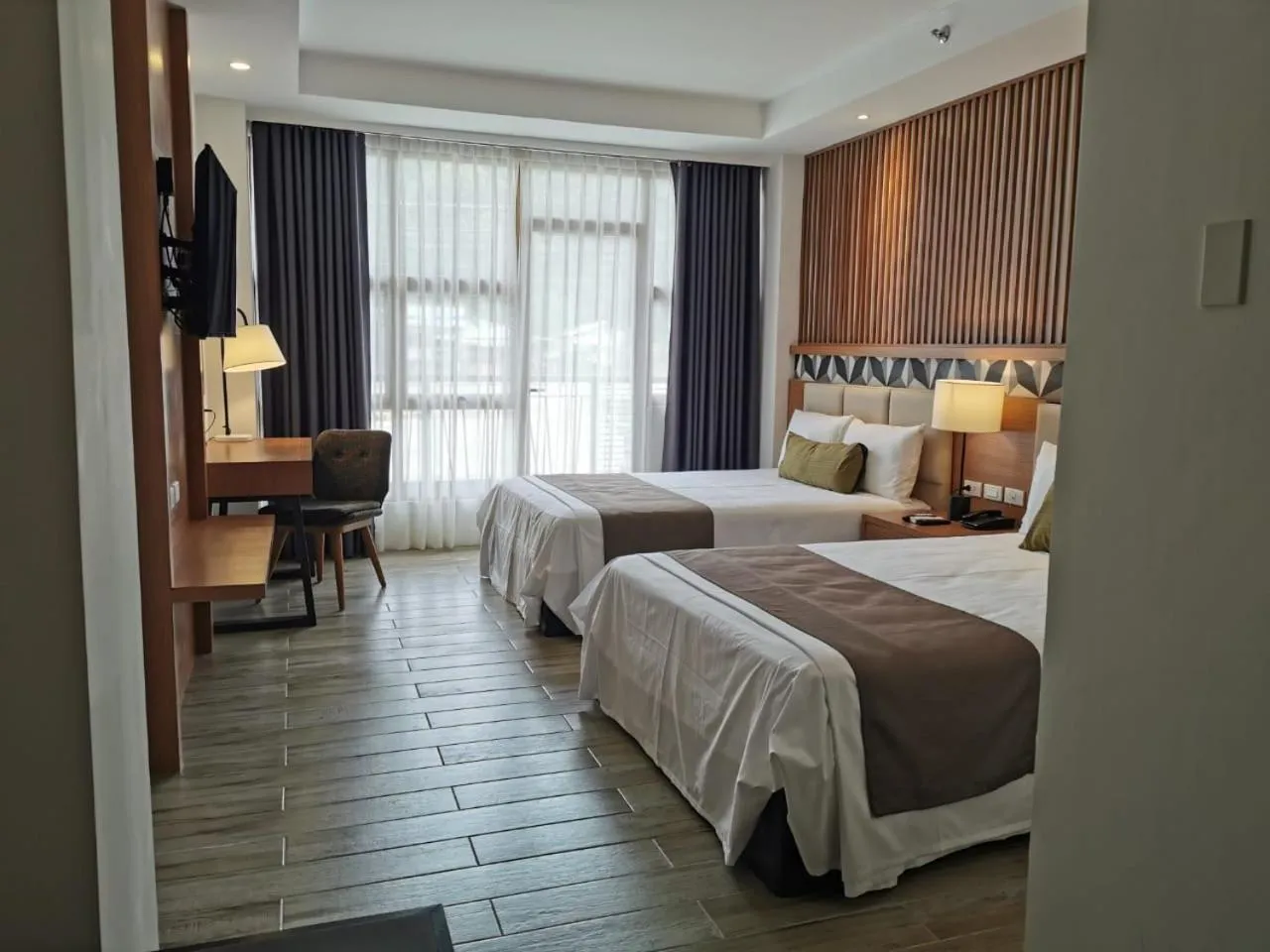 Bed in Crown Hotel at Harbour Springs Palawan Managed by Enderun Hotels