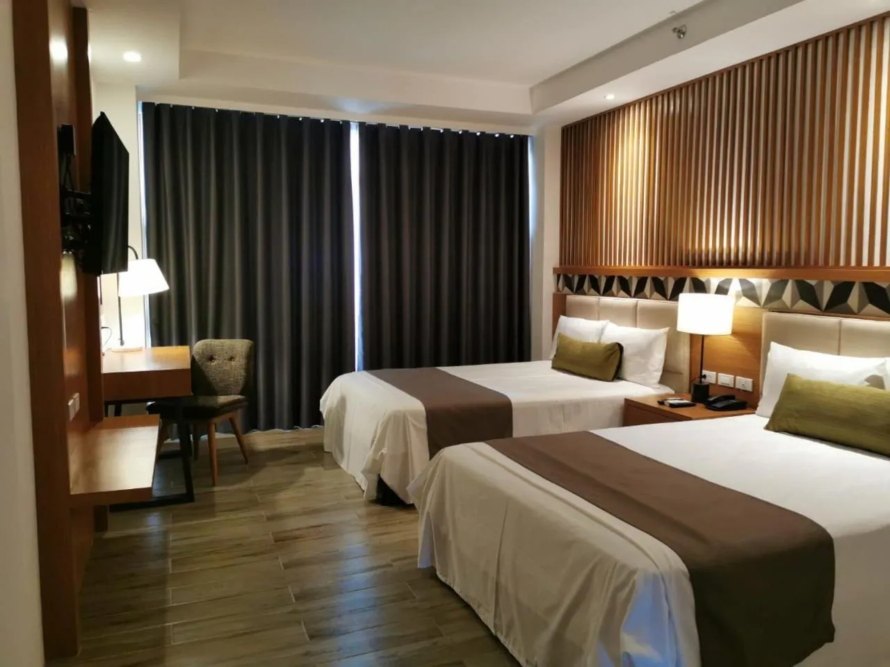 Photo of the whole room, Bed in Crown Hotel at Harbour Springs Palawan Managed by Enderun Hotels
