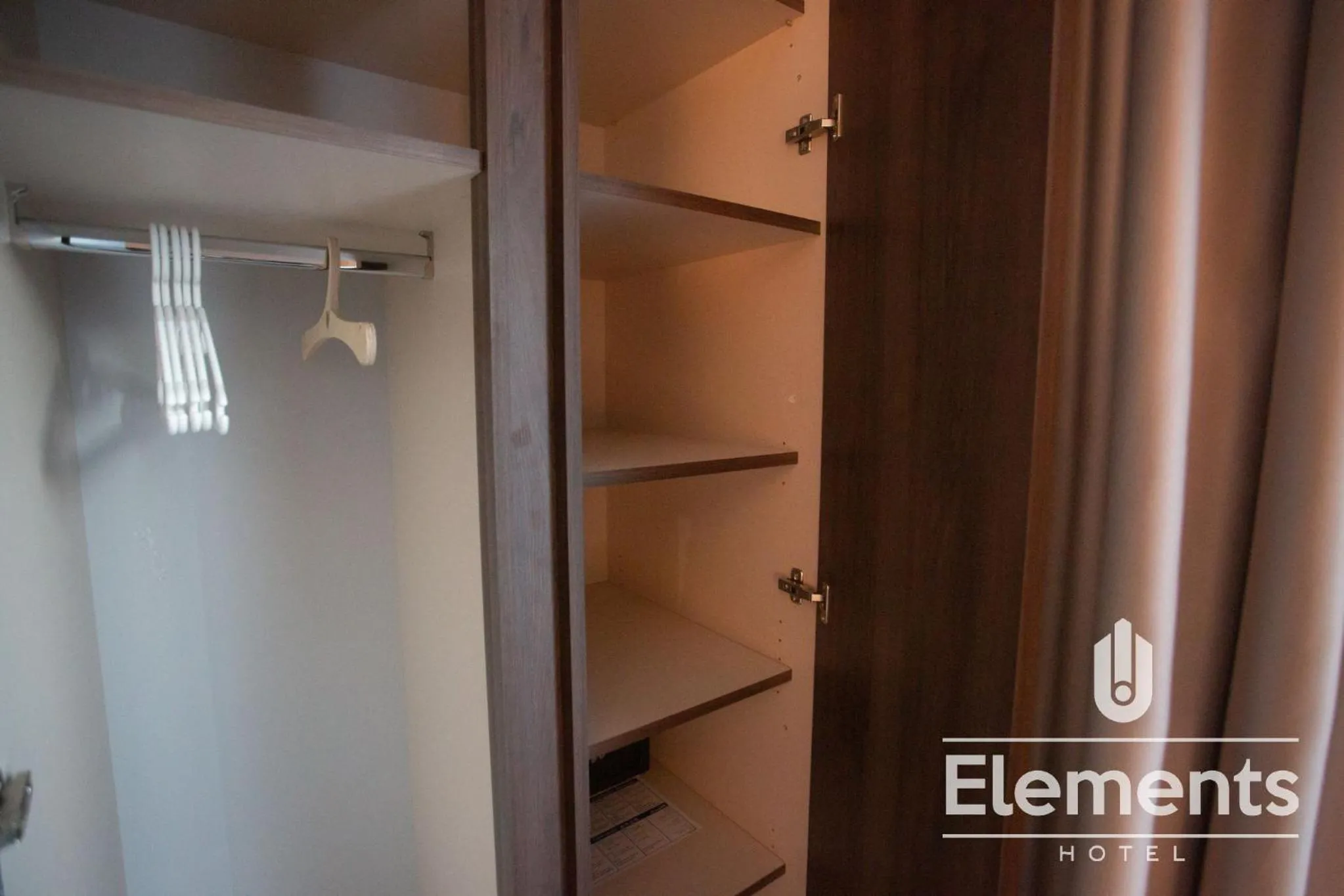 Property logo or sign in Hotel Elements