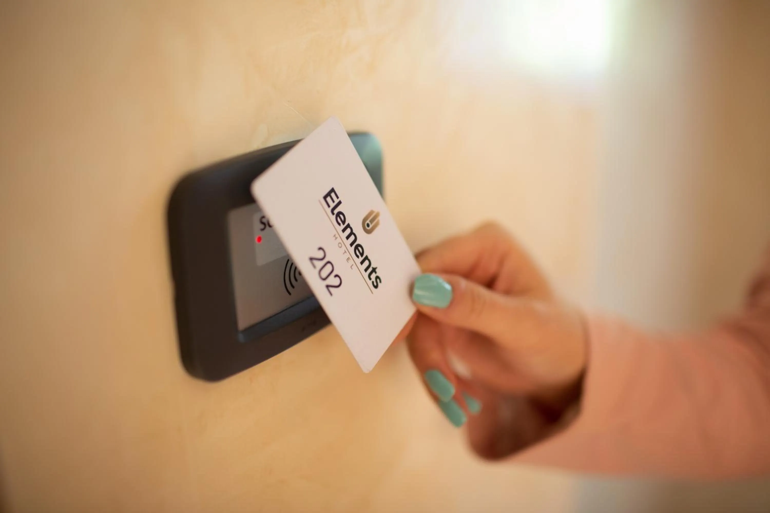 Property logo or sign in Hotel Elements