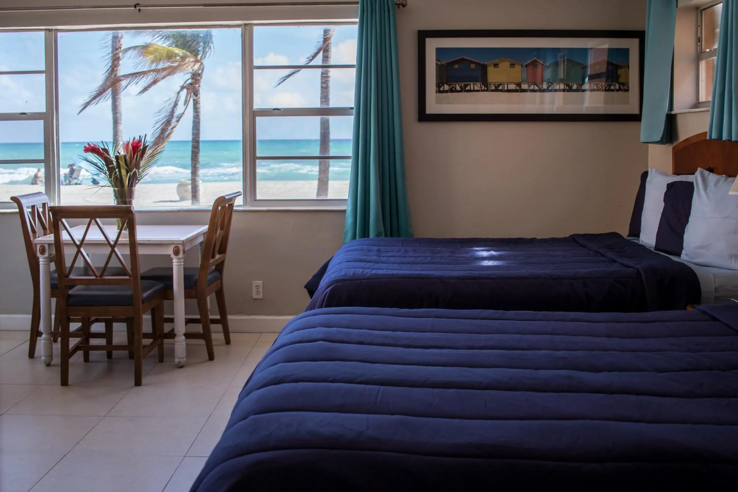 Bed in Riptide Oceanfront Hotel
