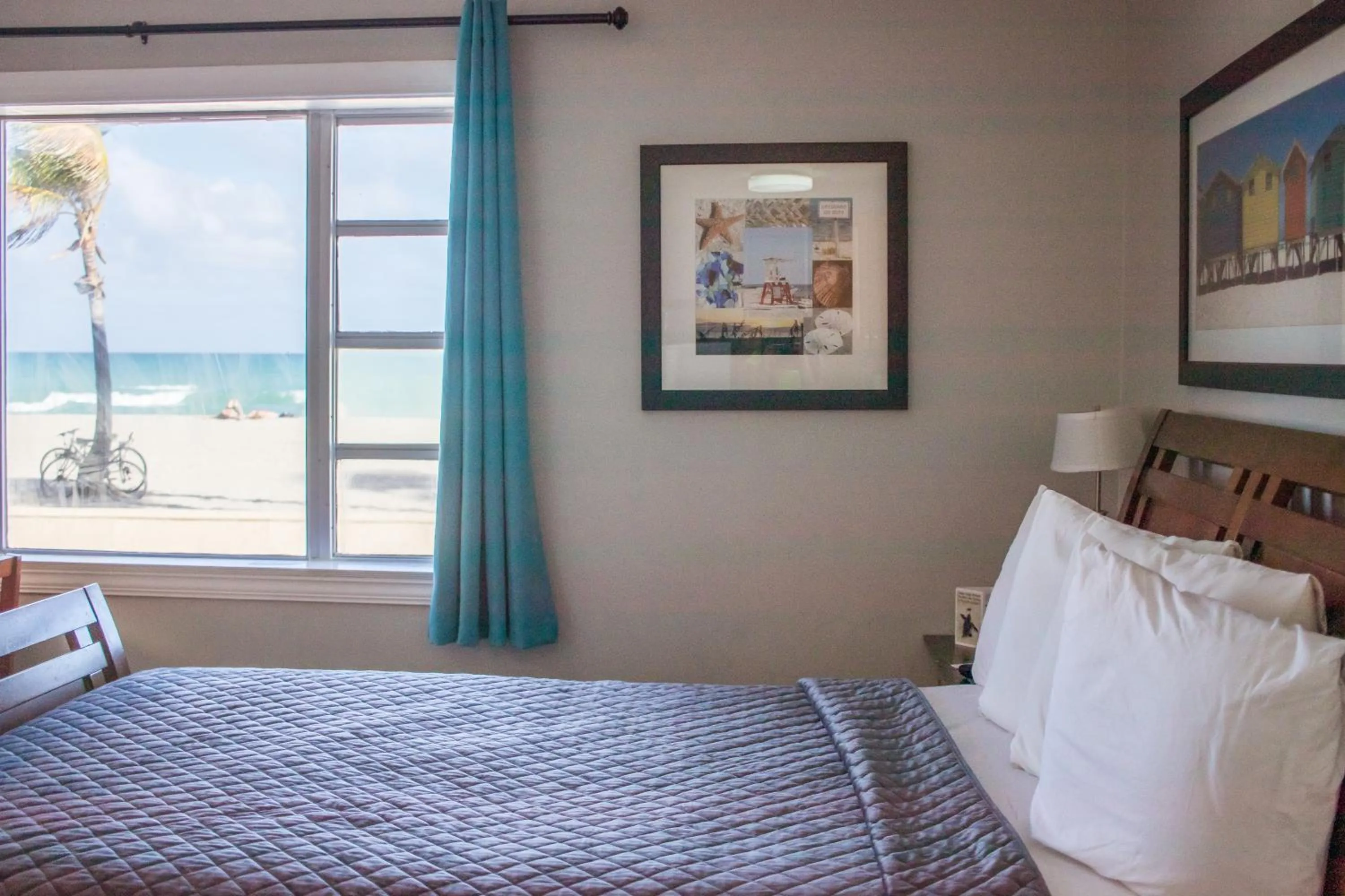 Bed in Riptide Oceanfront Hotel