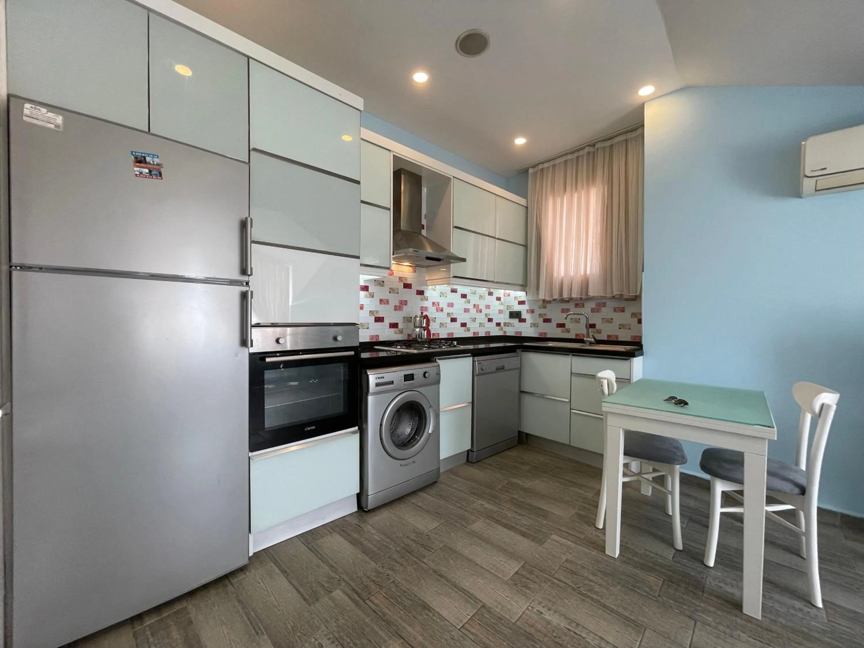 Kitchen or kitchenette in X SUITE APART
