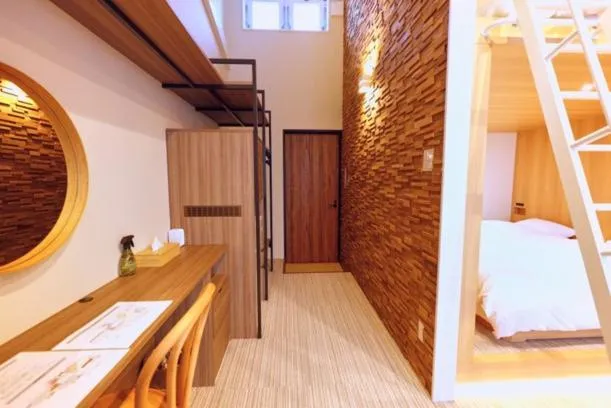 Bed in Chikura Tsunagu Hotel