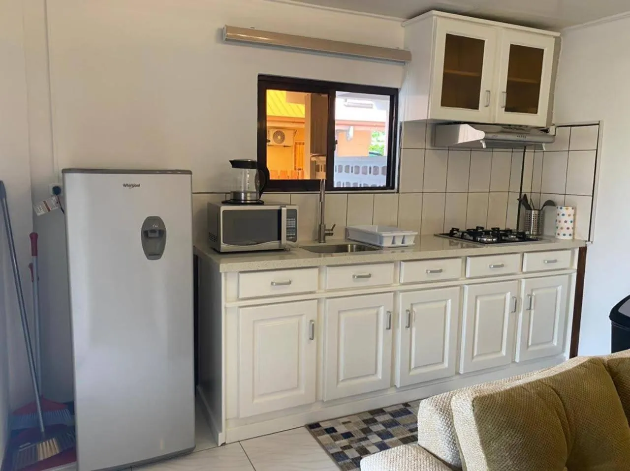 Kitchen or kitchenette in Max Garden and Pool