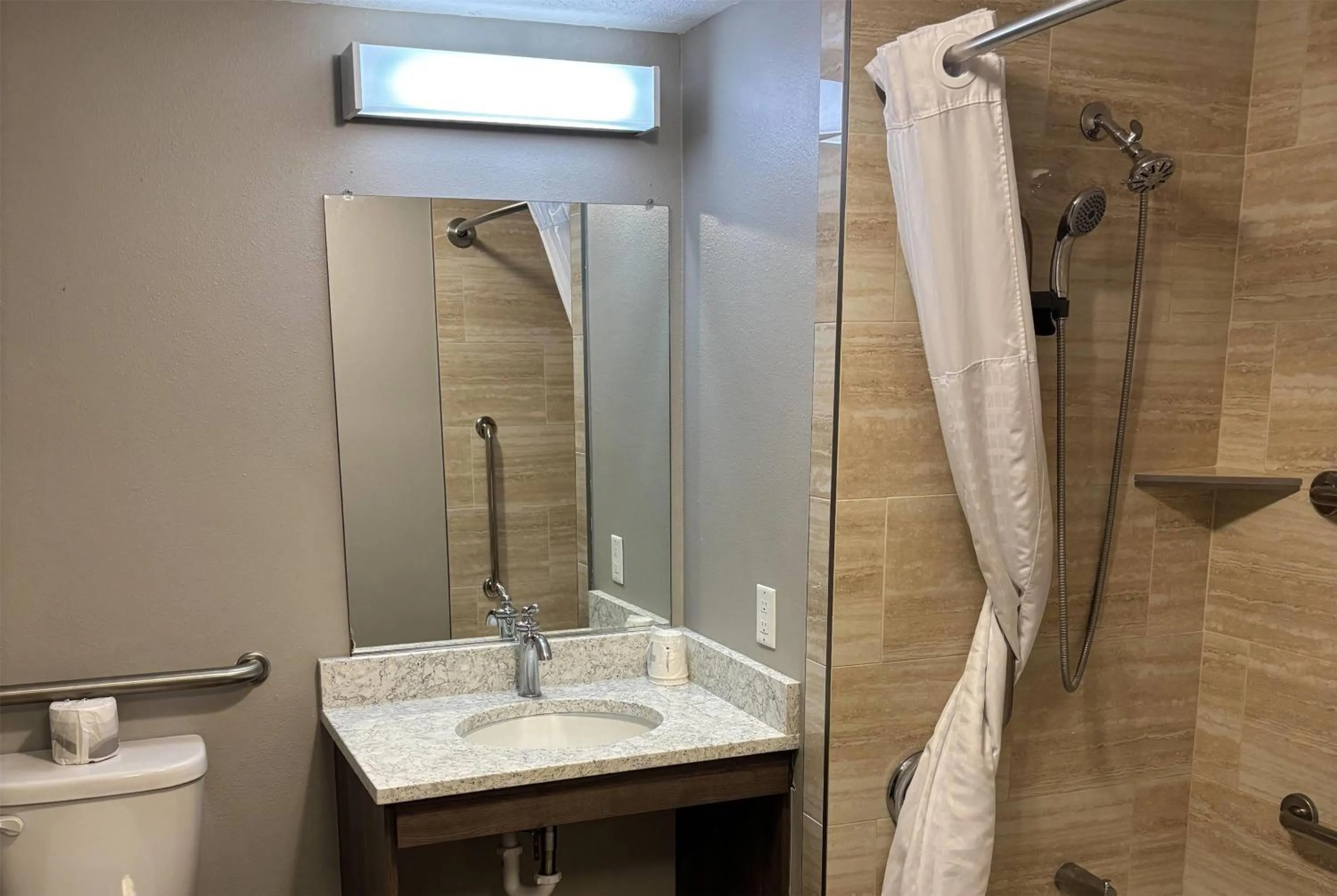 Bathroom in Super 8 by Wyndham Rexburg