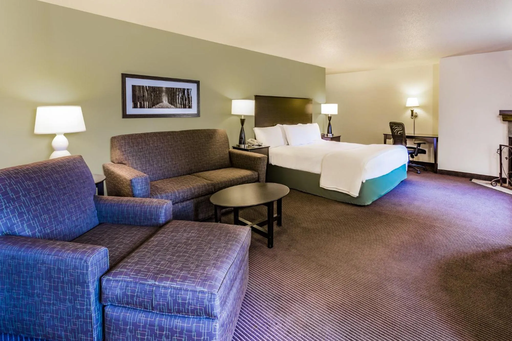Bed in AmericInn by Wyndham Hampton