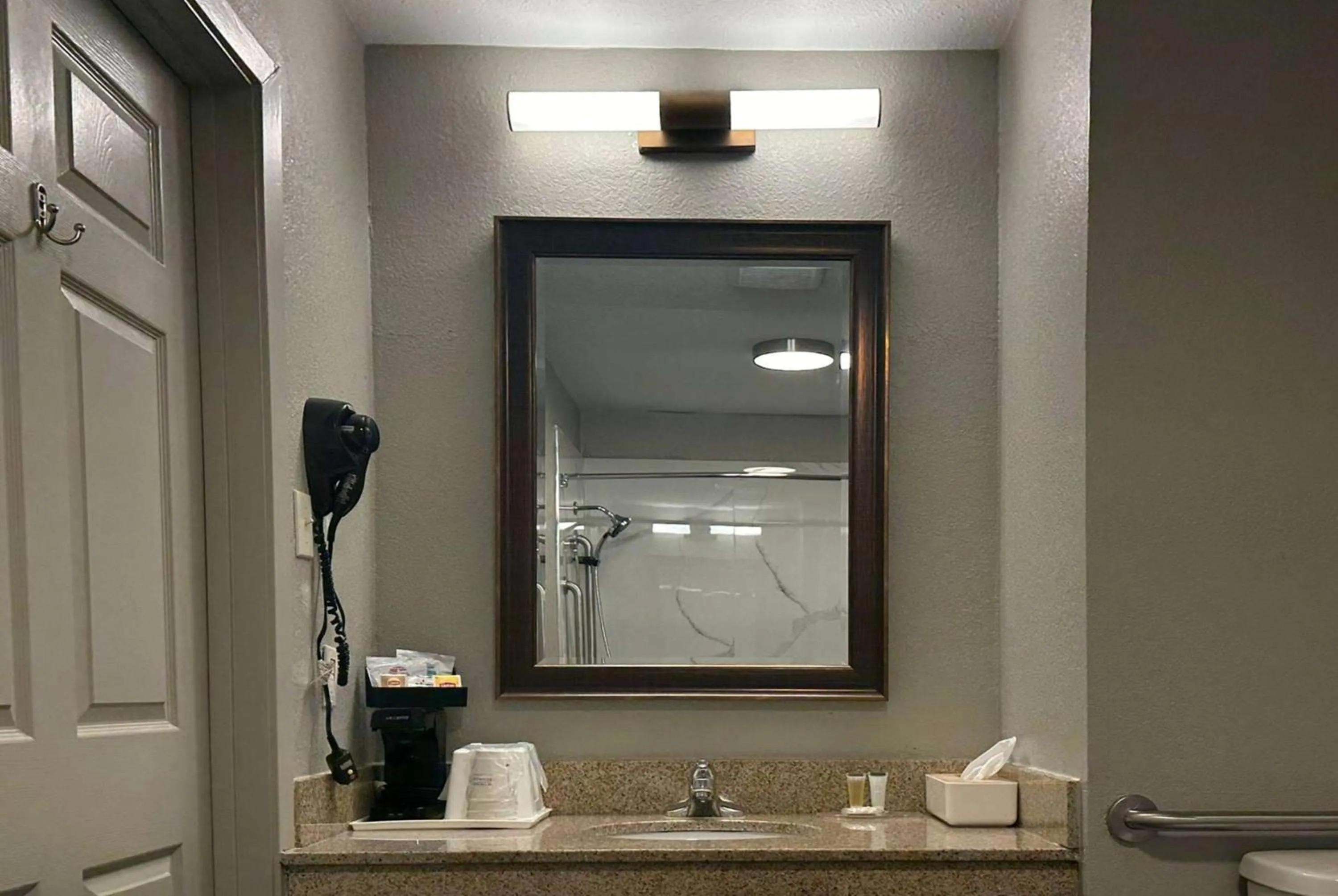 Bathroom in Super 8 by Wyndham Monroe