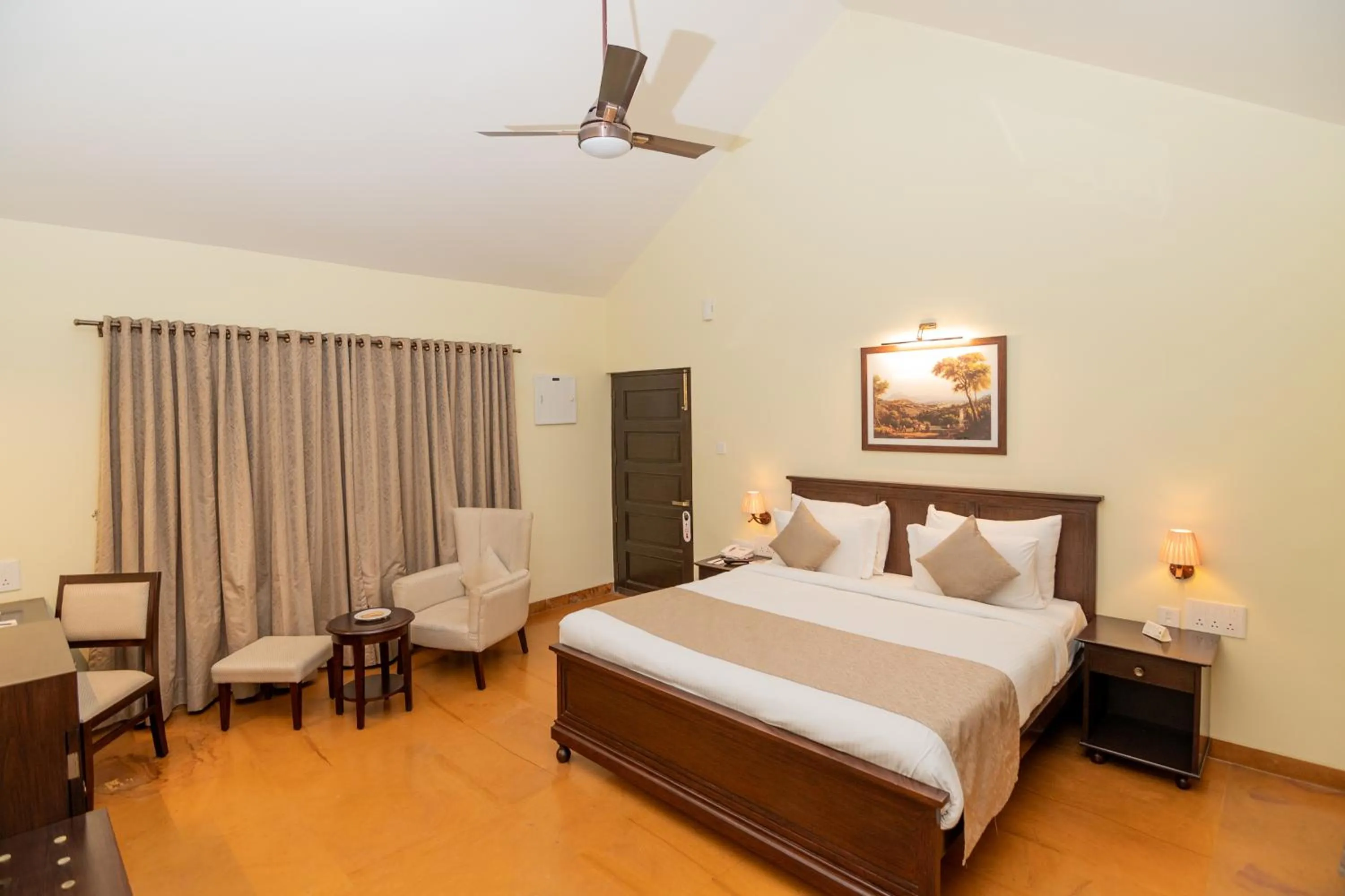 Bed in WelcomHeritage Tadoba Vanya Villas Resort & Spa