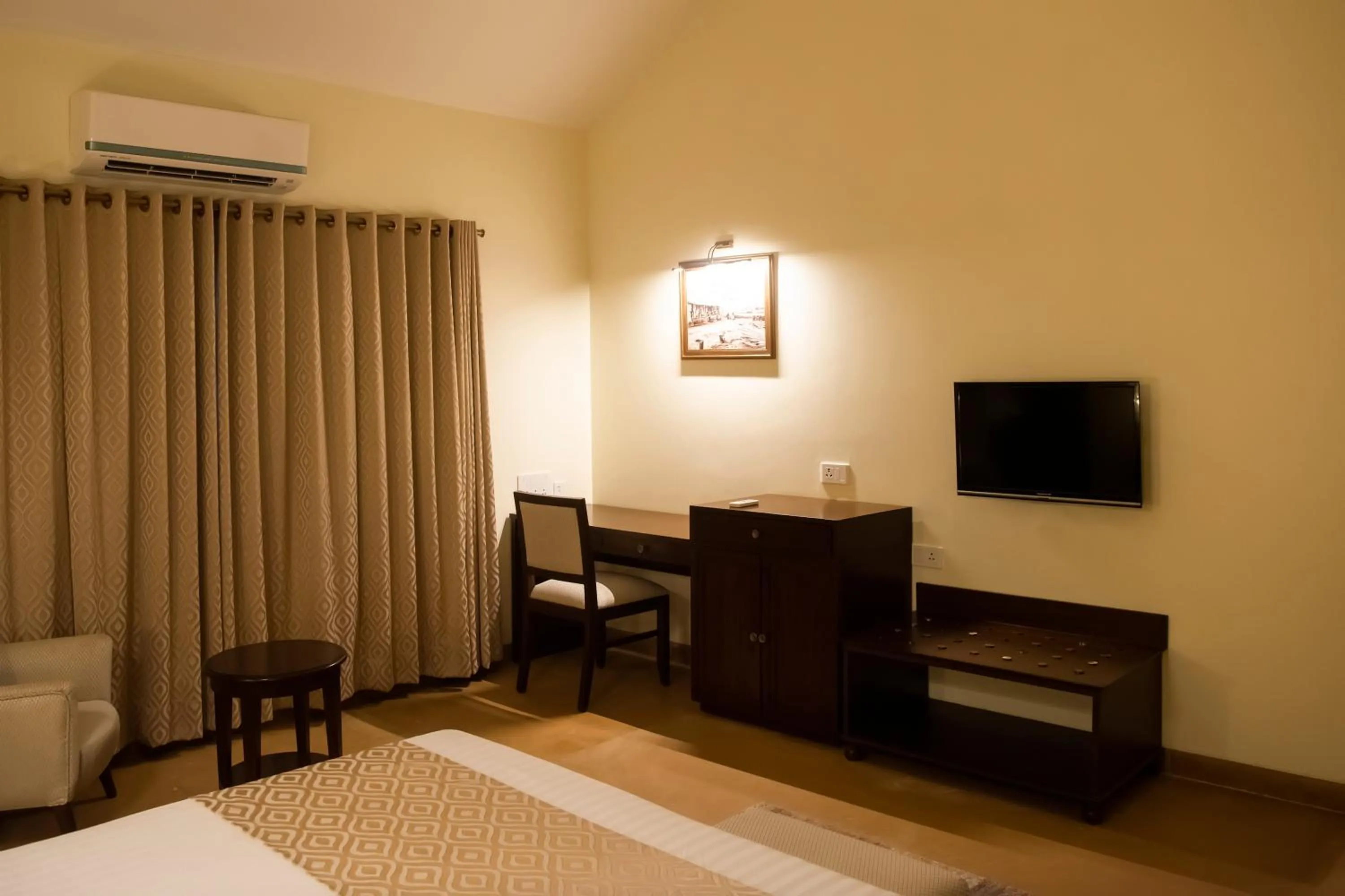 Bed in WelcomHeritage Tadoba Vanya Villas Resort & Spa