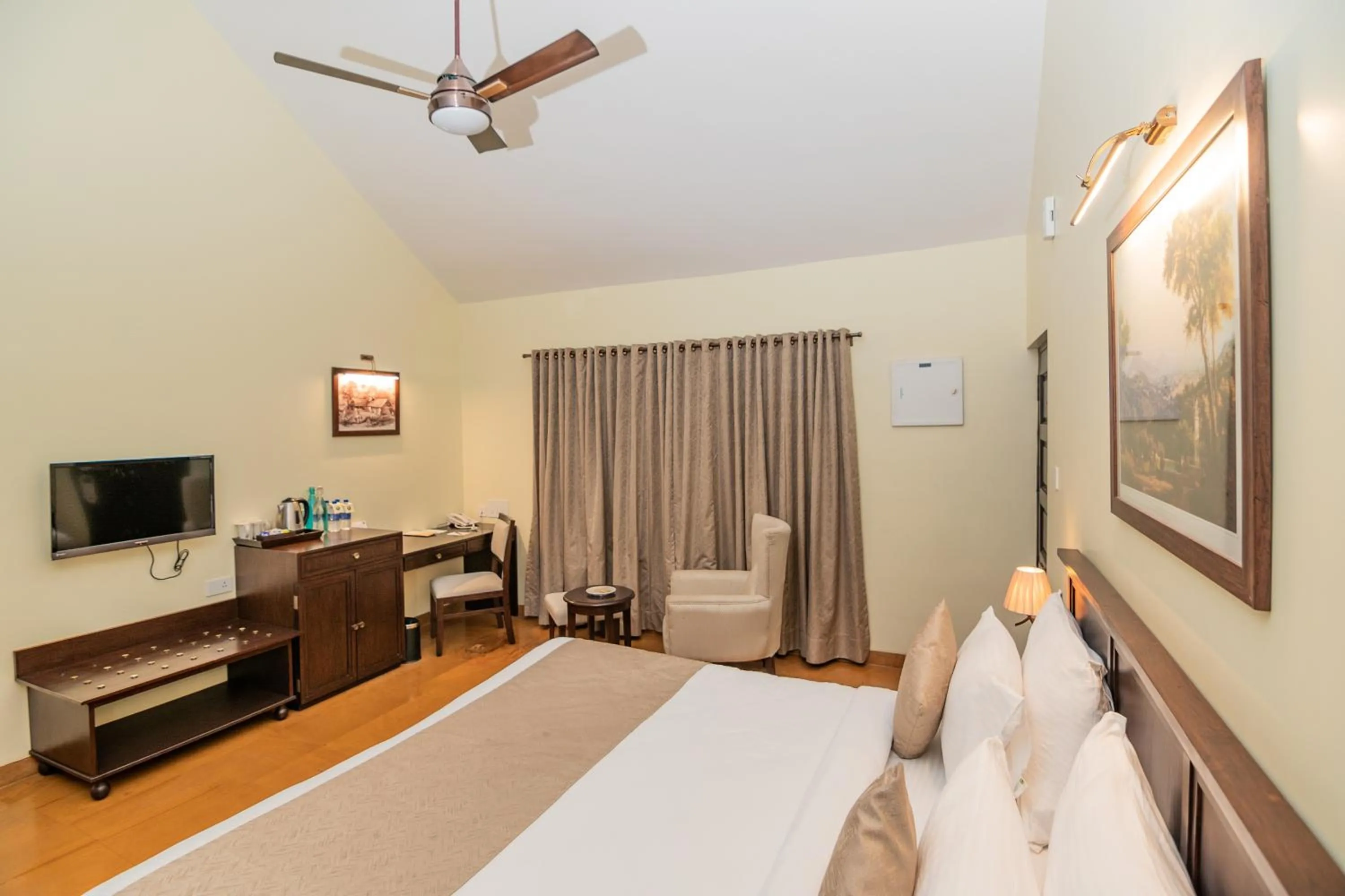 Bed in WelcomHeritage Tadoba Vanya Villas Resort & Spa