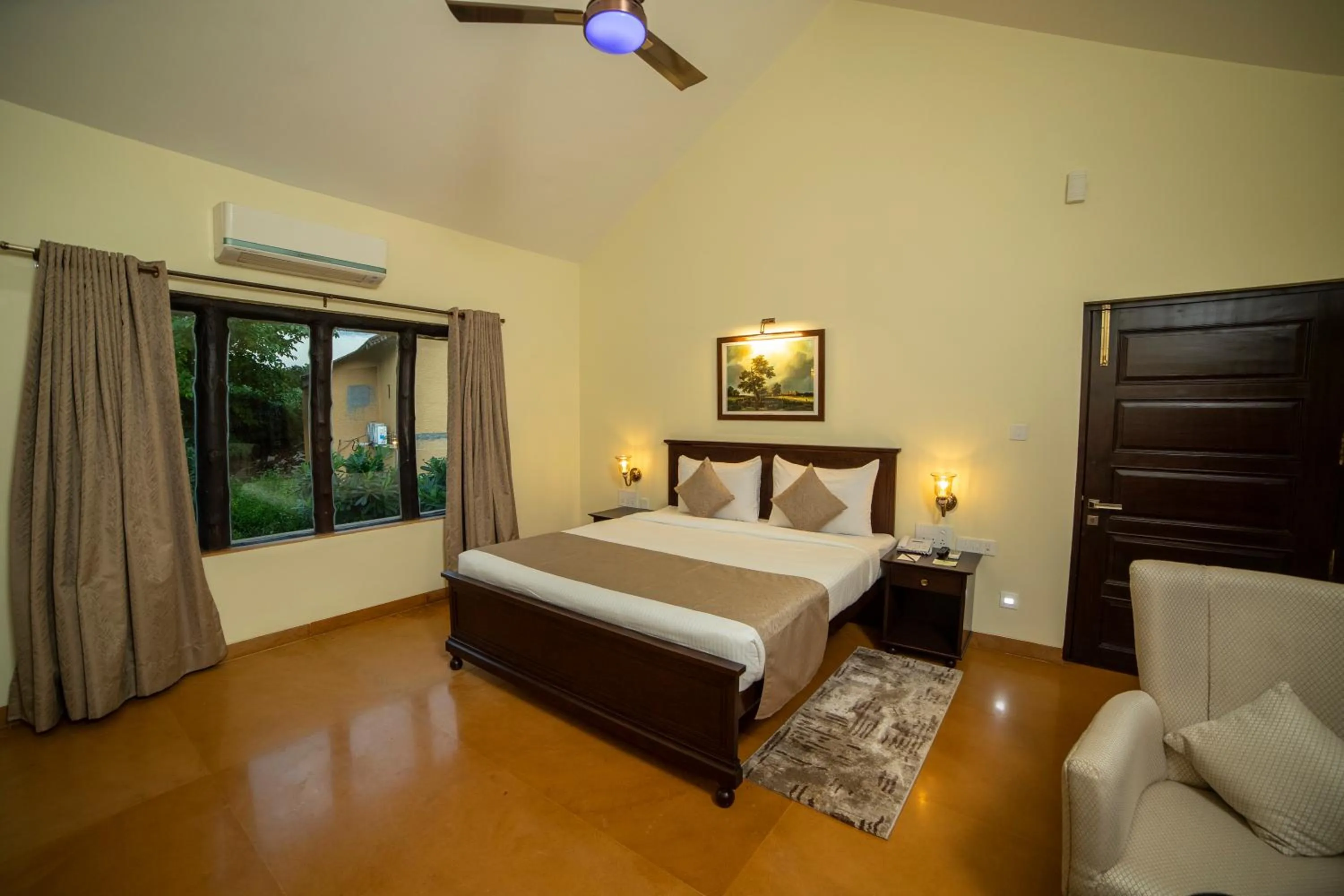 Bed in WelcomHeritage Tadoba Vanya Villas Resort & Spa