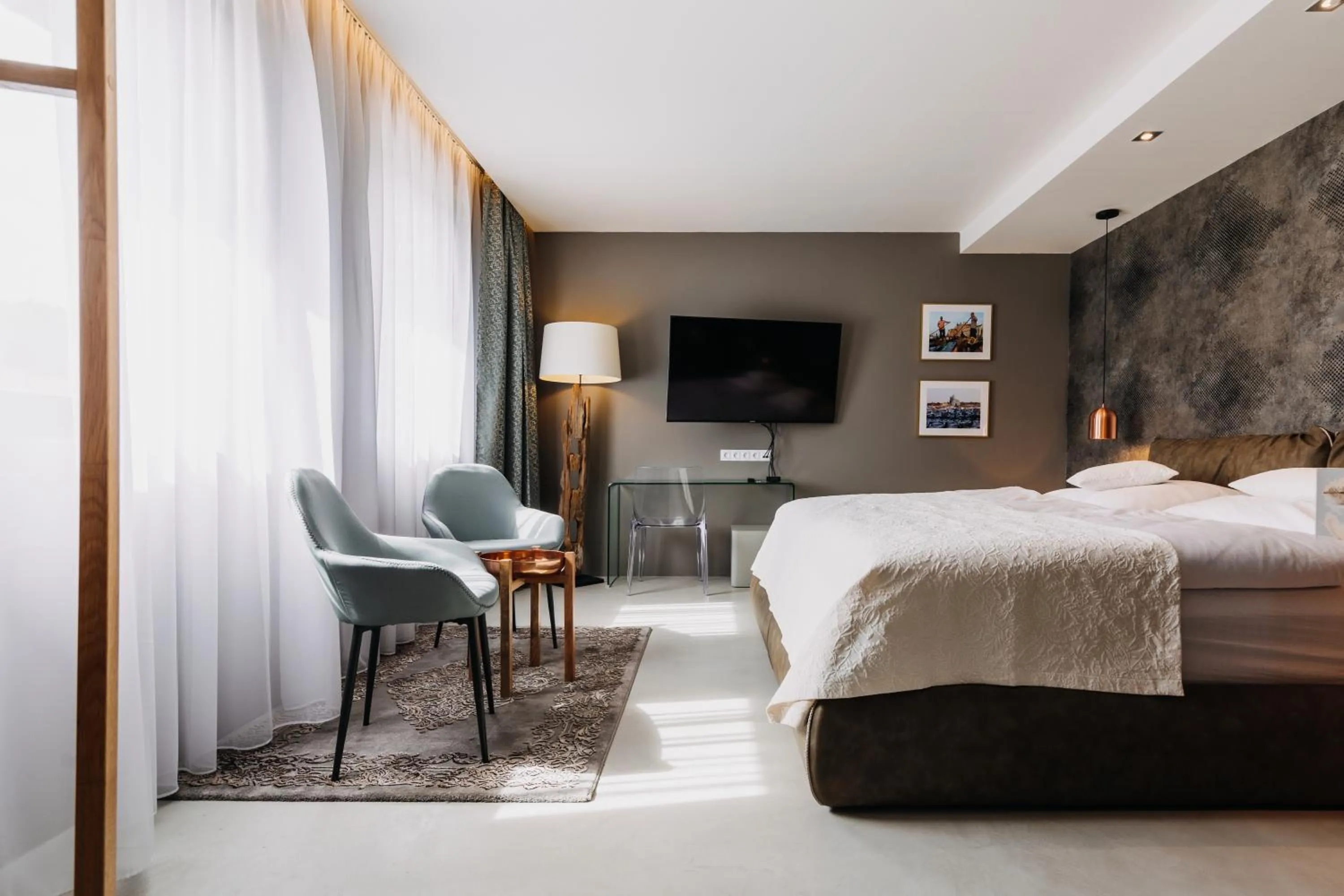 Seating area, Bed in VILLA BRICOLA - Boutique Apartments