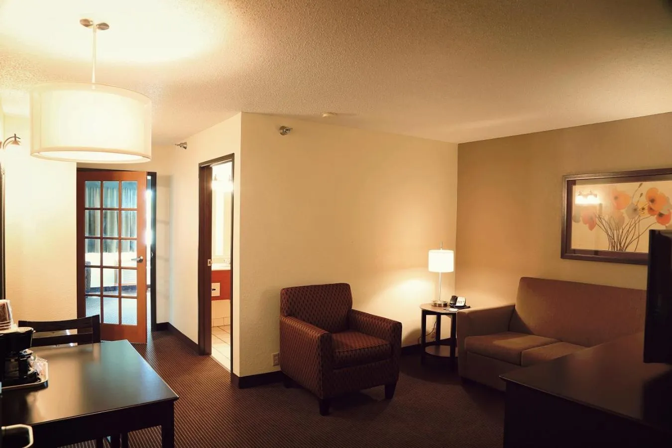Living room in AmericInn by Wyndham Wadena