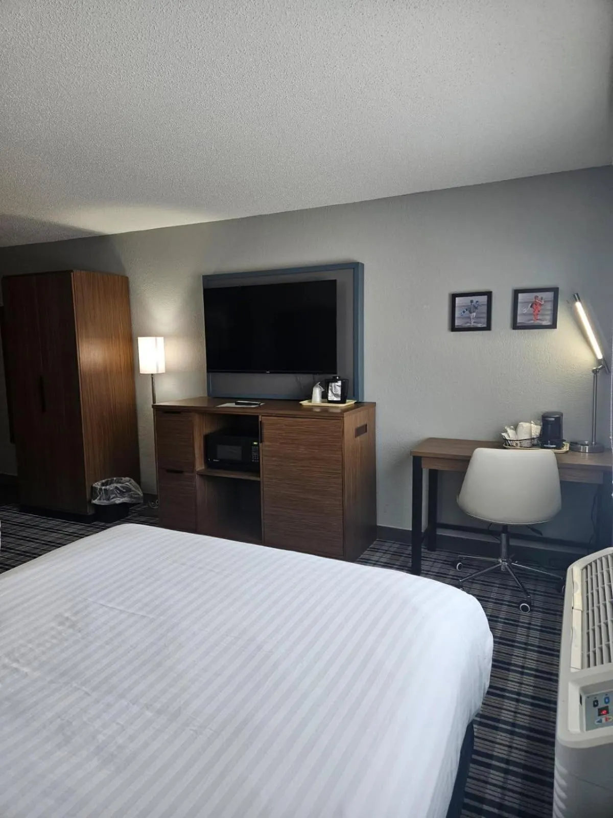 Communal lounge/ TV room, Bed in AmericInn by Wyndham Albert Lea