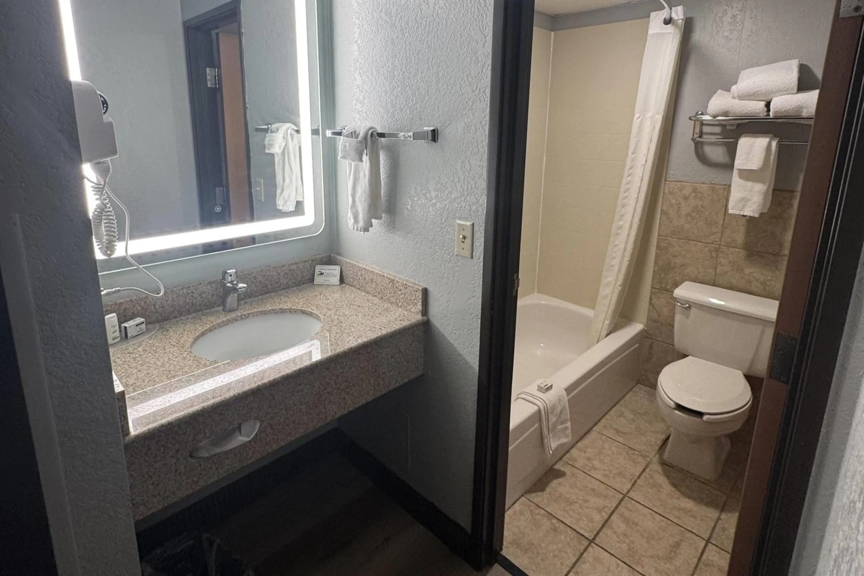 Bathroom in AmericInn by Wyndham Albert Lea