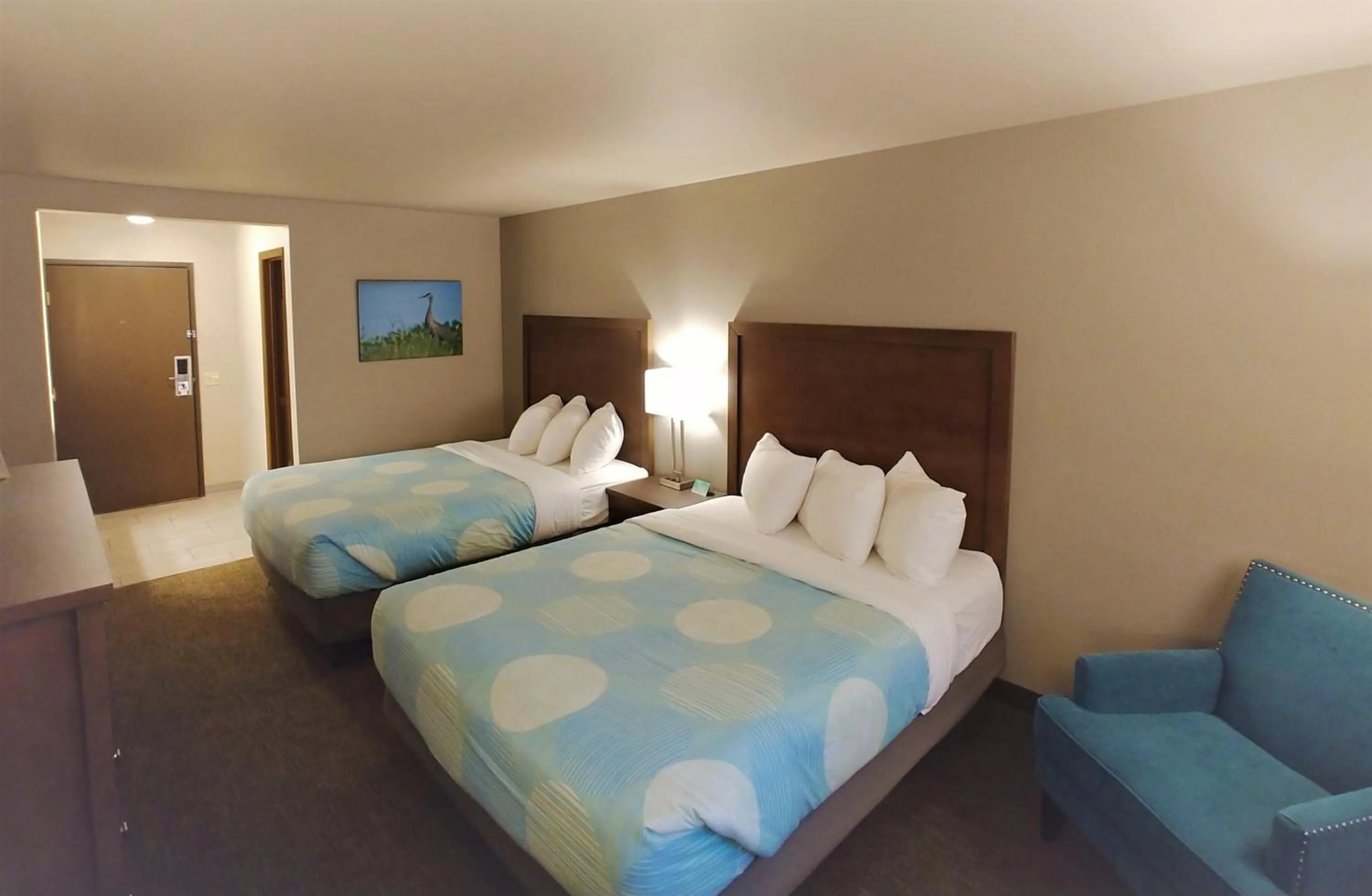 Bed in Sandhill Inn & Suites