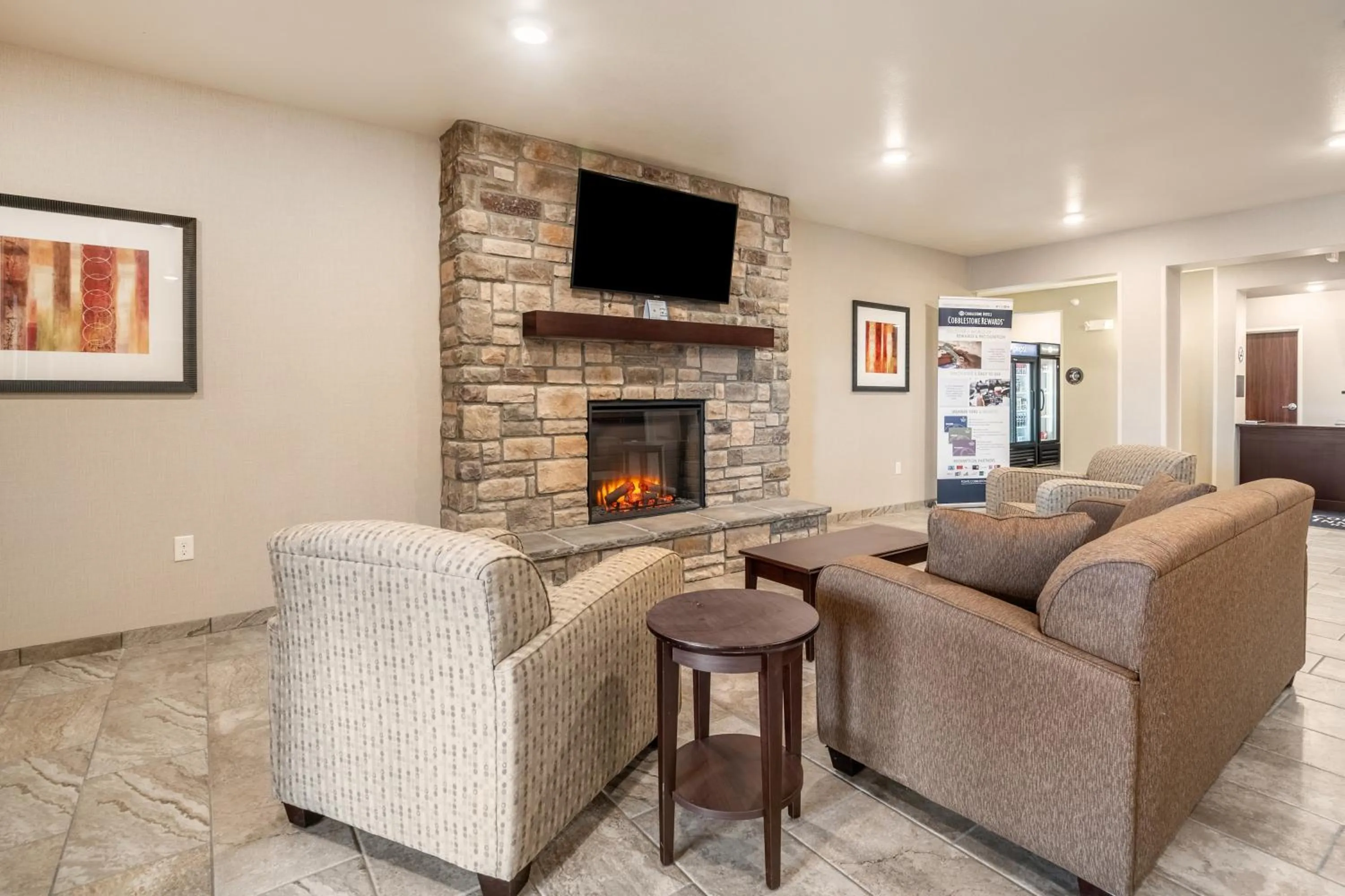 Communal lounge/ TV room in Cobblestone Inn & Suites - Kermit