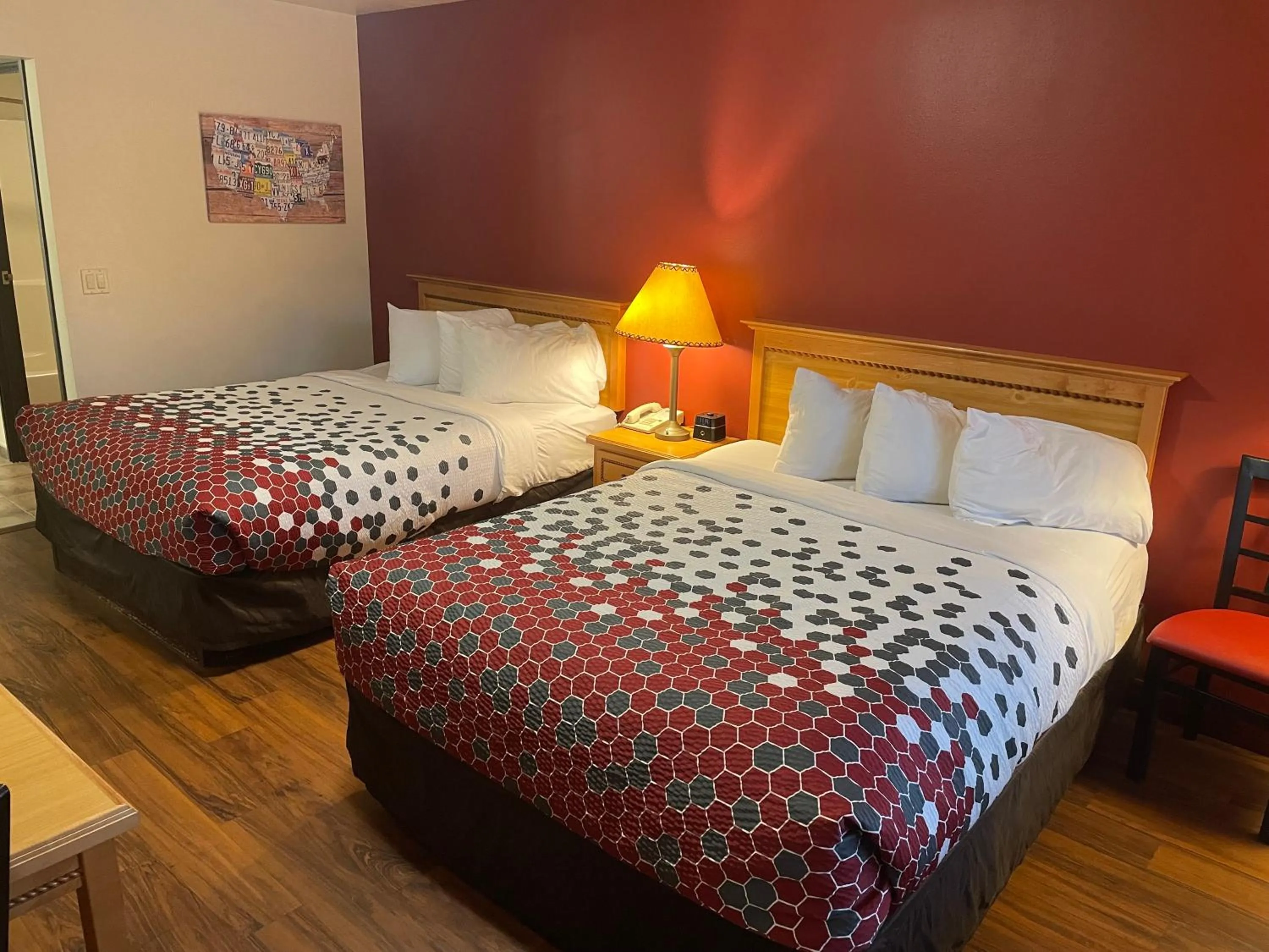 Bed in Harmony Inn & Suites