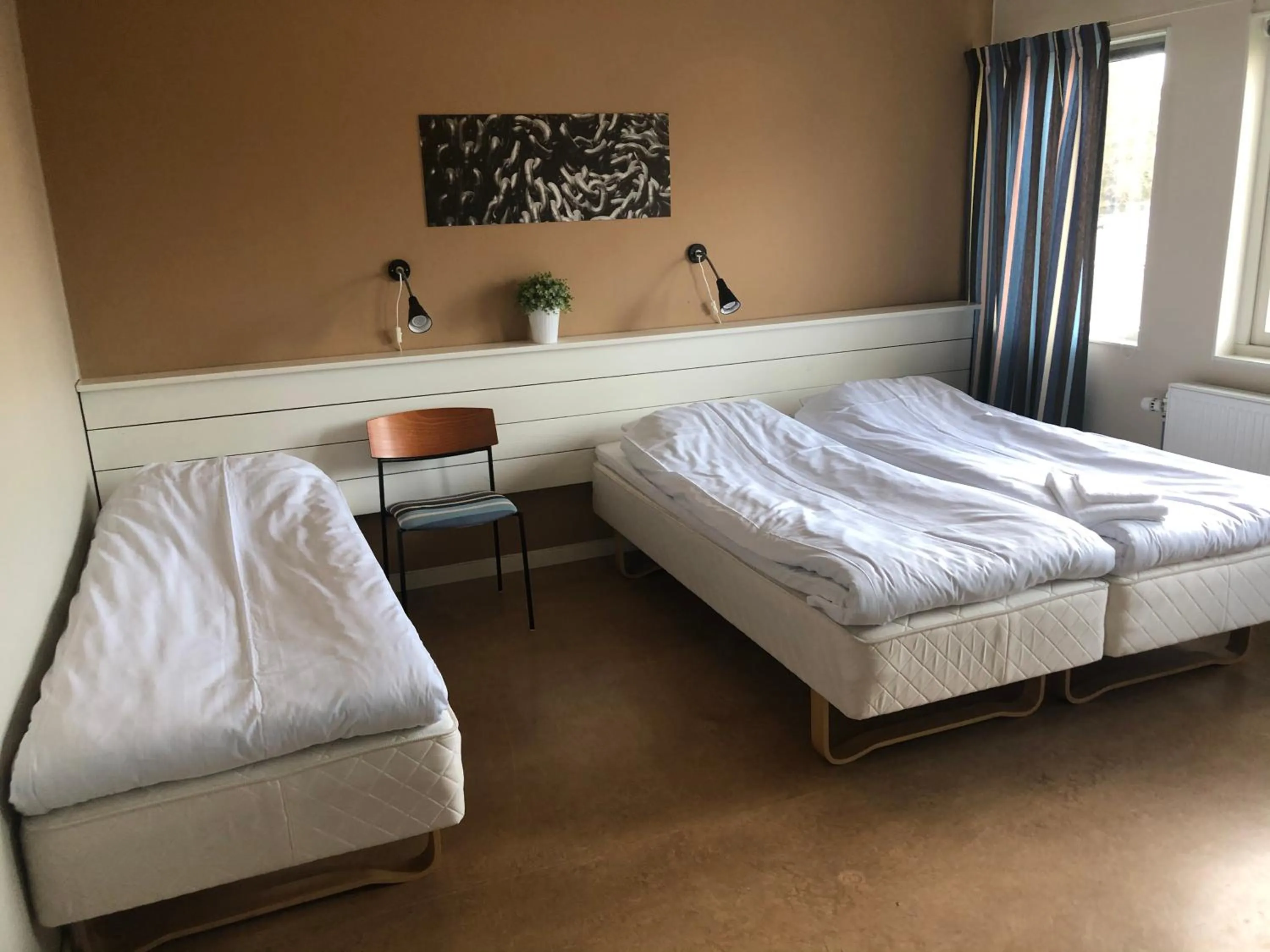 Bed in Spångholmen Bed & Breakfast AB