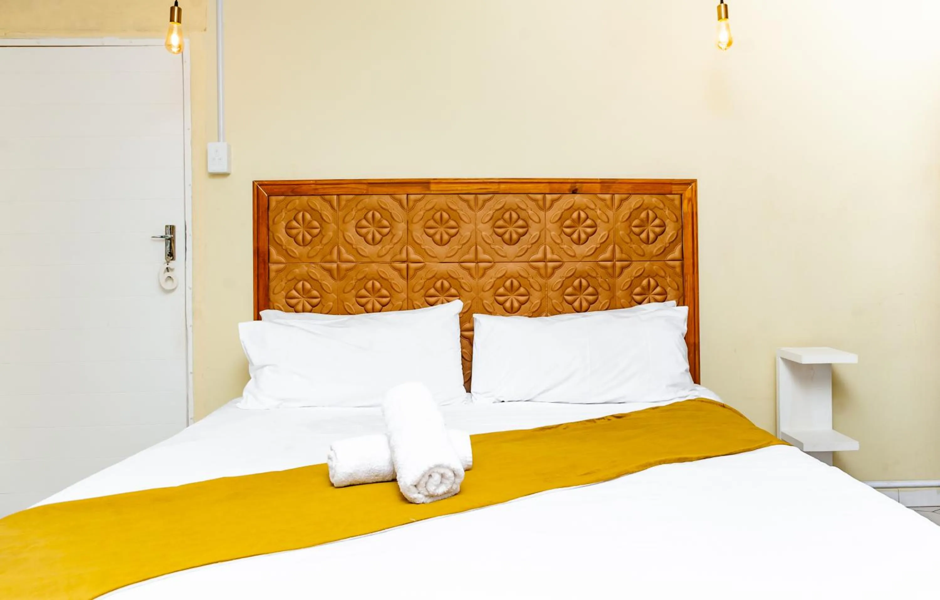 towels, Bed in Nkosazana Guest House