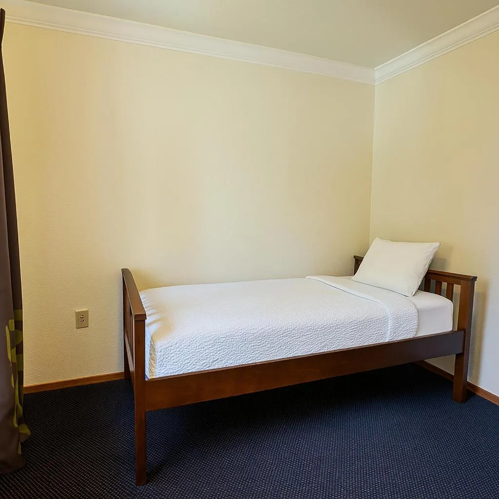 Bed in Creekside Inn & Suites