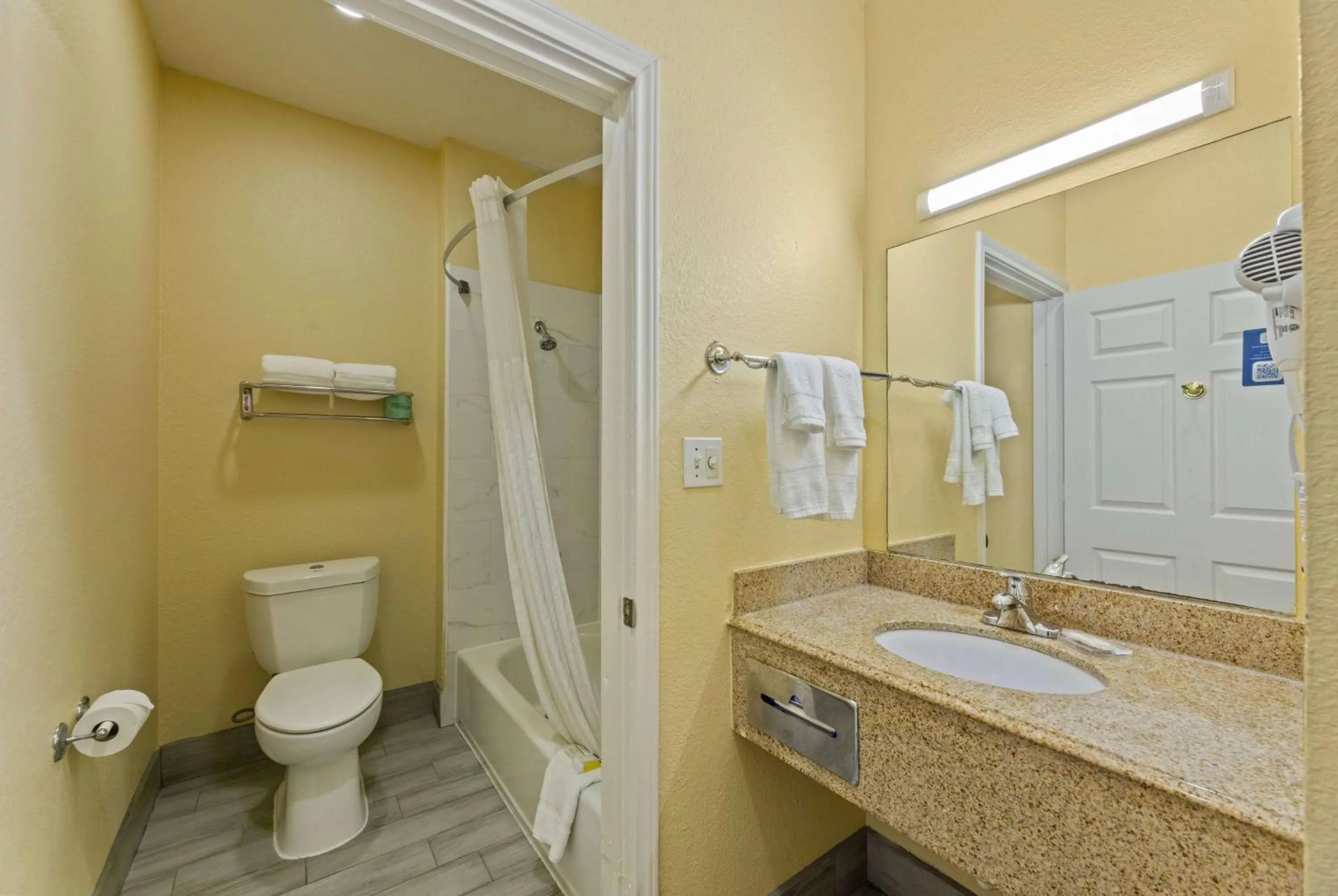 Bathroom in Days Inn & Suites by Wyndham DFW Airport South-Euless
