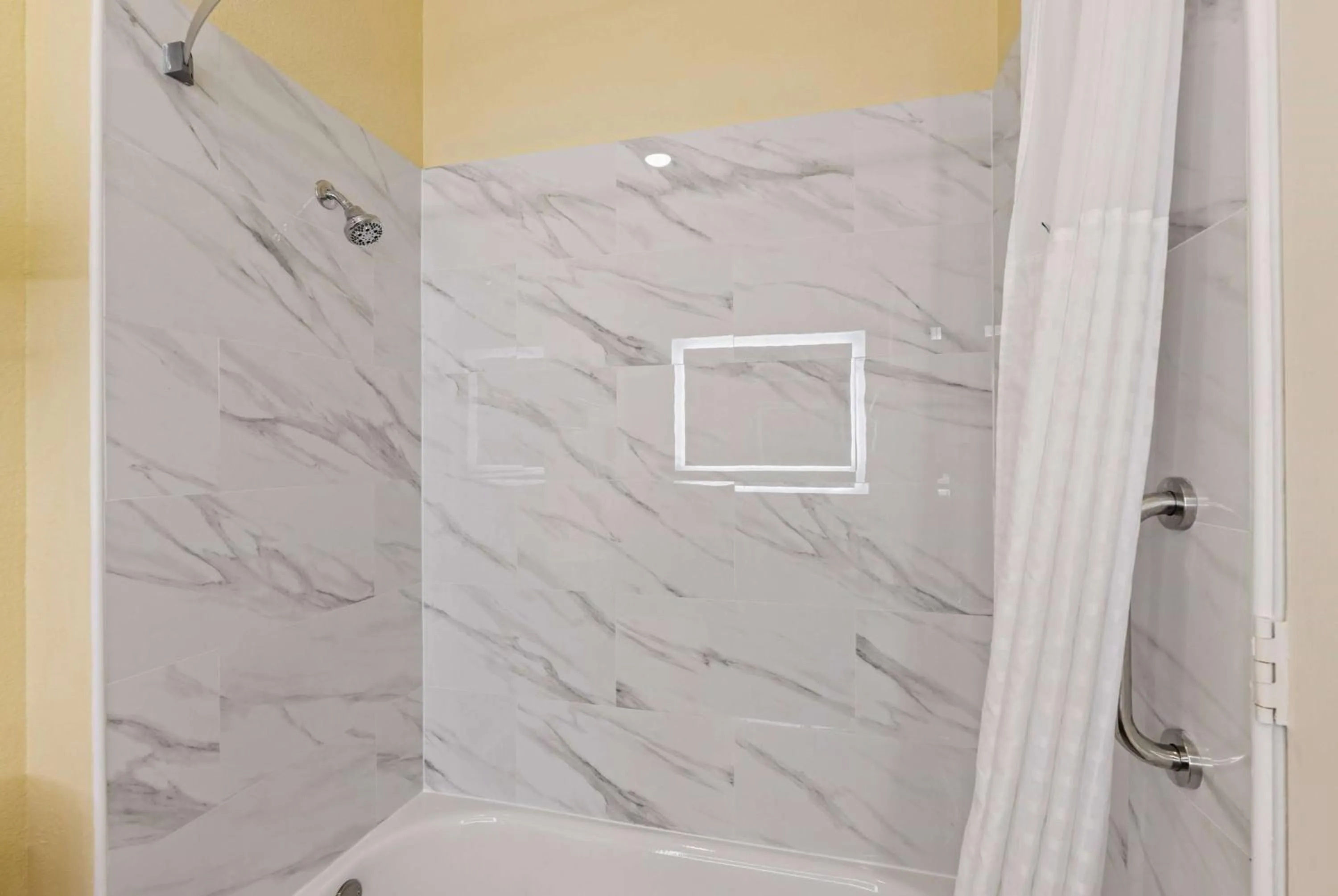 Bathroom in Days Inn & Suites by Wyndham DFW Airport South-Euless