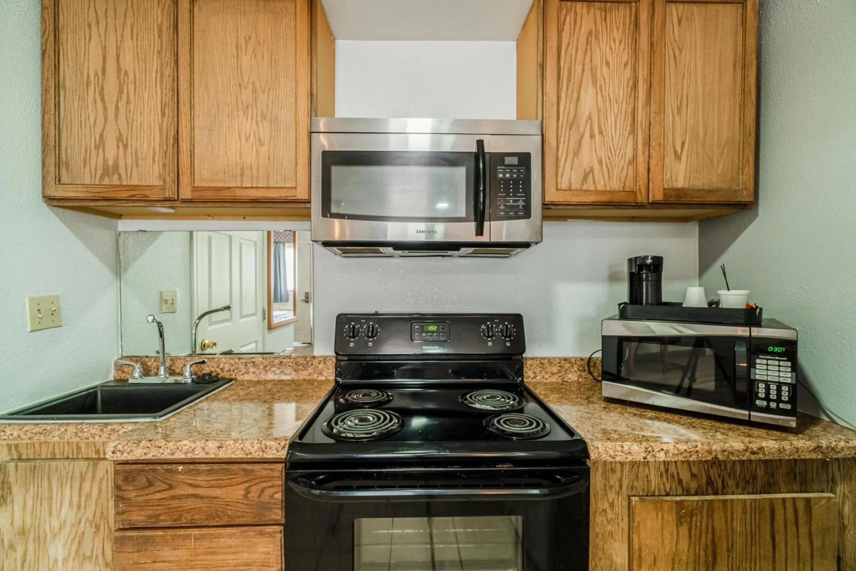 Kitchen or kitchenette in Purple Sage By OYO Snyder TX