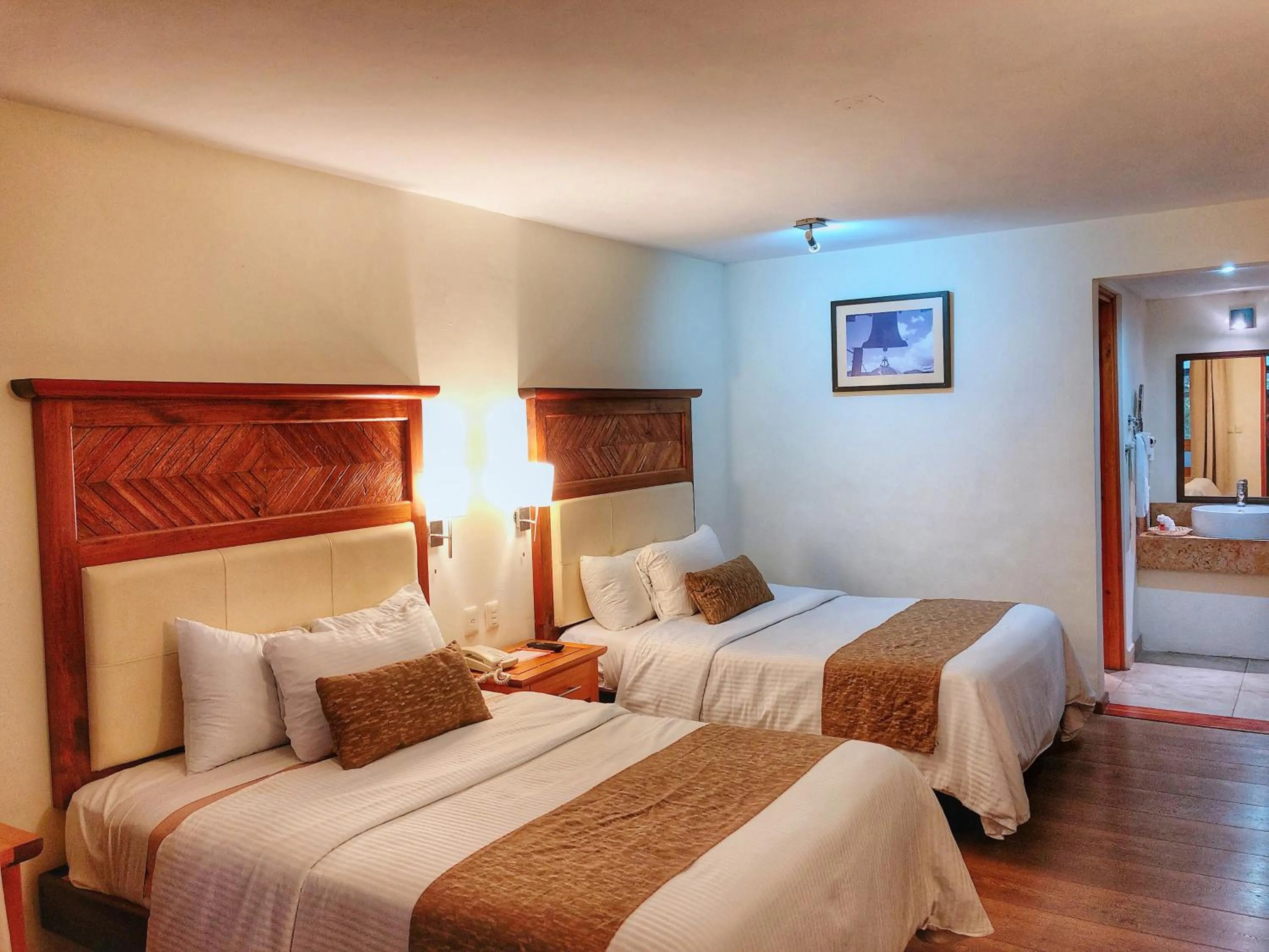 Bed in Plaza Magnolias Suites