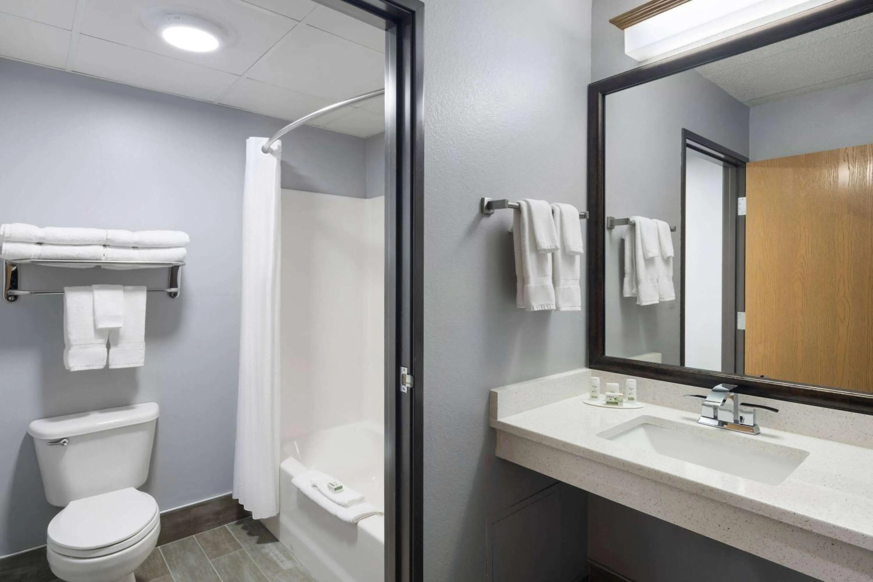 Bathroom in AmericInn by Wyndham Stuart