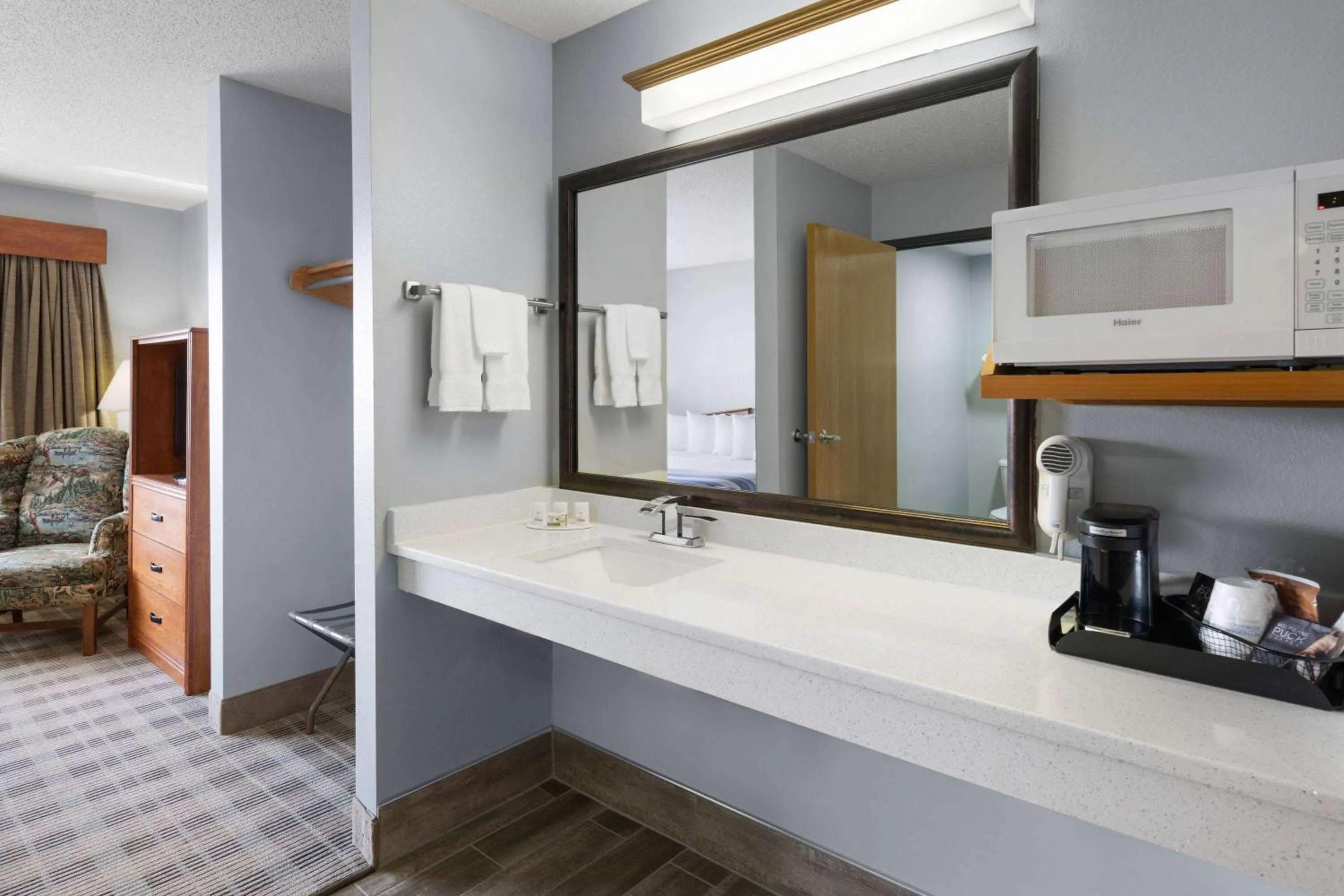 Bathroom, Bed in AmericInn by Wyndham Stuart