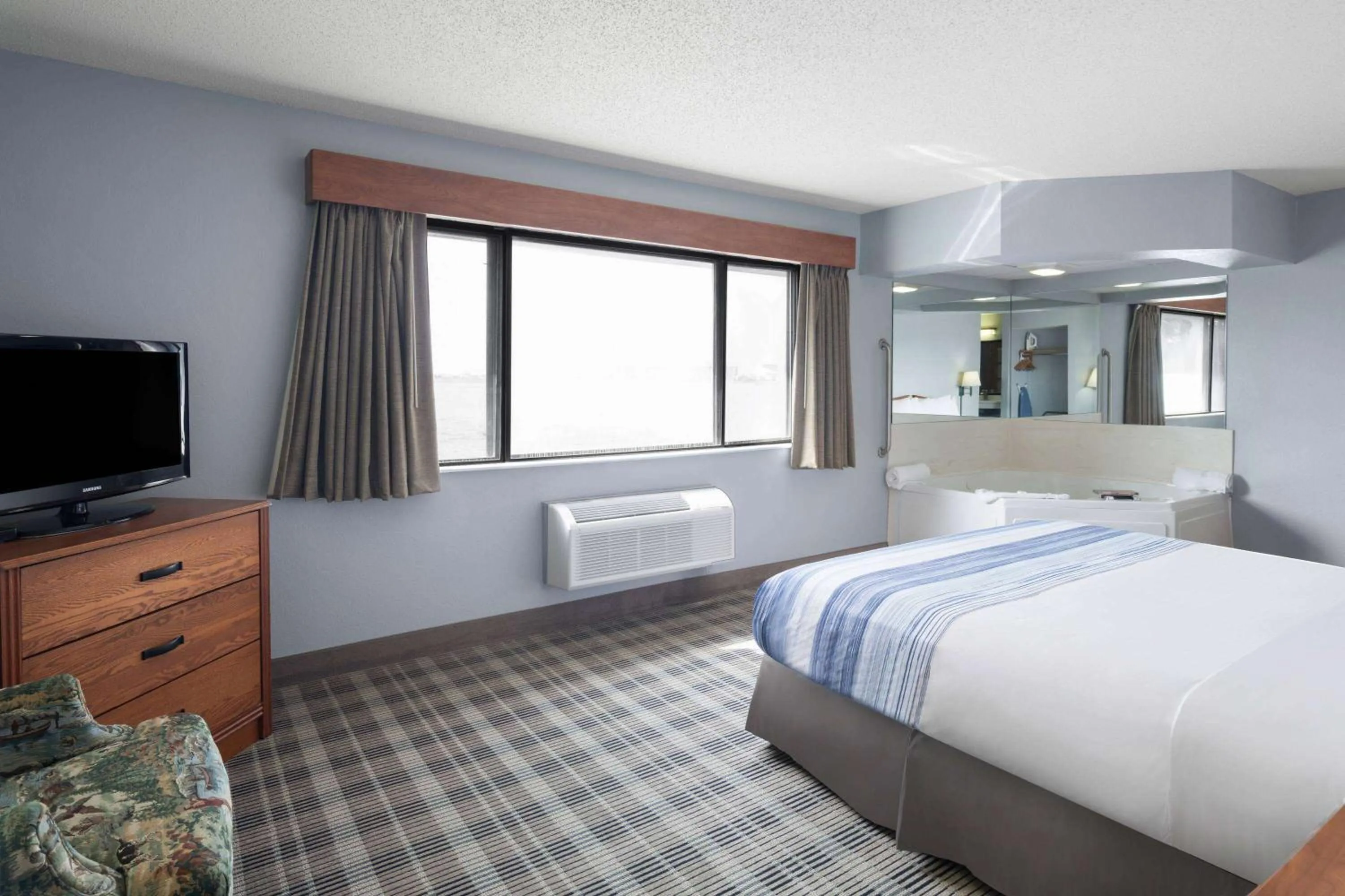 Photo of the whole room, Bed in AmericInn by Wyndham Stuart